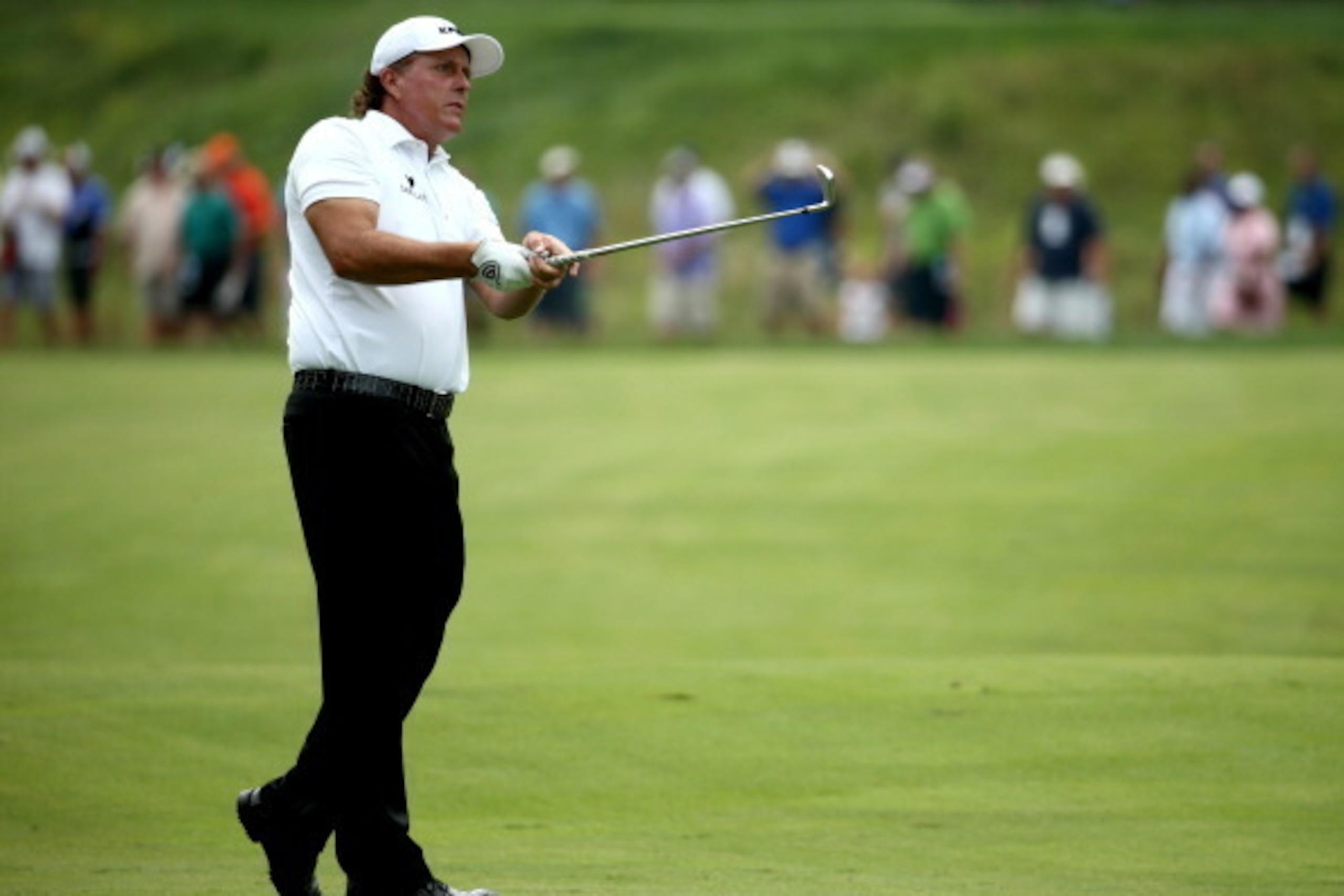 LOUISVILLE, KY - AUGUST 07: Phil Mickelson of the United States hits an approach shot during the first round of the 96th PGA Championship at Valhalla Golf Club on August 7, 2014 in Louisville, Kentucky. (Photo by Warren Little/Getty Images) LOUISVILLE, KY - AUGUST 07: Phil Mickelson of the United States hits an approach shot during the first round of the 96th PGA Championship at Valhalla Golf Club on August 7, 2014 in Louisville, Kentucky. (Photo by Warren Little/Getty Images)