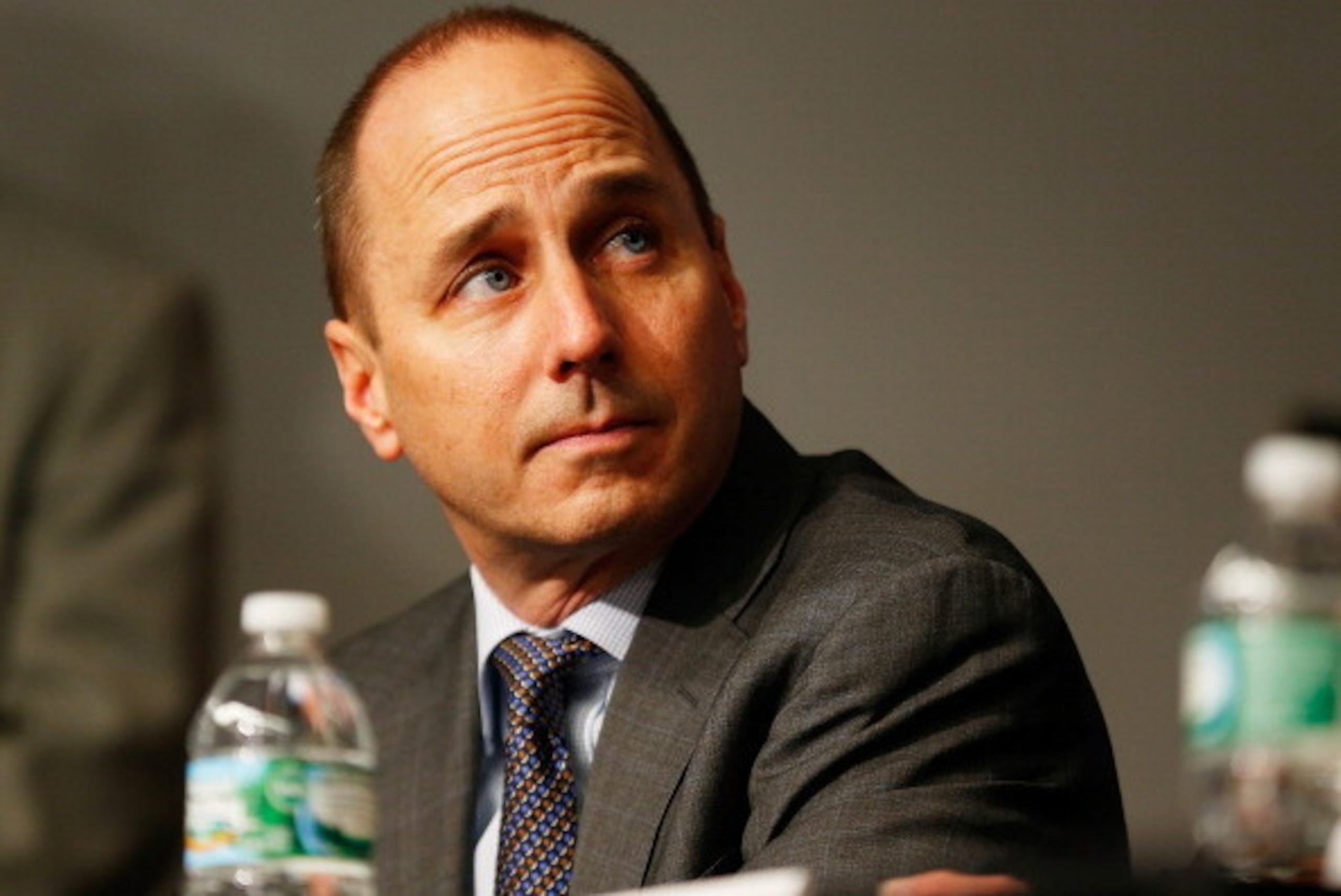 NEW YORK, NY - DECEMBER 20:  General Manager Brian Cashman looks on during Carlos Beltran's introductory press conference at Yankee Stadium on December 20, 2013 in the Bronx borough of New York City.  (Photo by Mike Stobe/Getty Images)