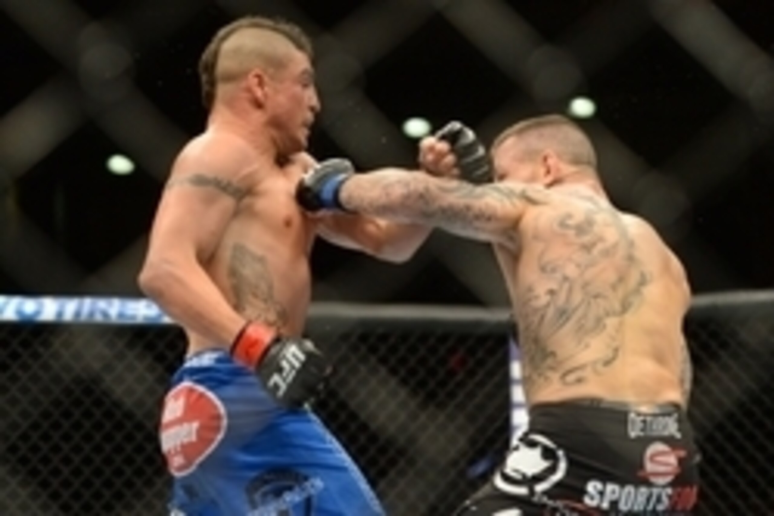 Jun 7, 2014; Albuquerque, NM, USA; Diego Sanchez (red) and Ross Pearson (blue) fight during their lightweight bout during UFC Fight Night 42 at Tingley Coliseum. Sanchez won via split decision. Mandatory Credit: Joe Camporeale-USA TODAY Sports Jun 7, 2014; Albuquerque, NM, USA; Diego Sanchez (red) and Ross Pearson (blue) fight during their lightweight bout during UFC Fight Night 42 at Tingley Coliseum. Sanchez won via split decision. Mandatory Credit: Joe Camporeale-USA TODAY Sports