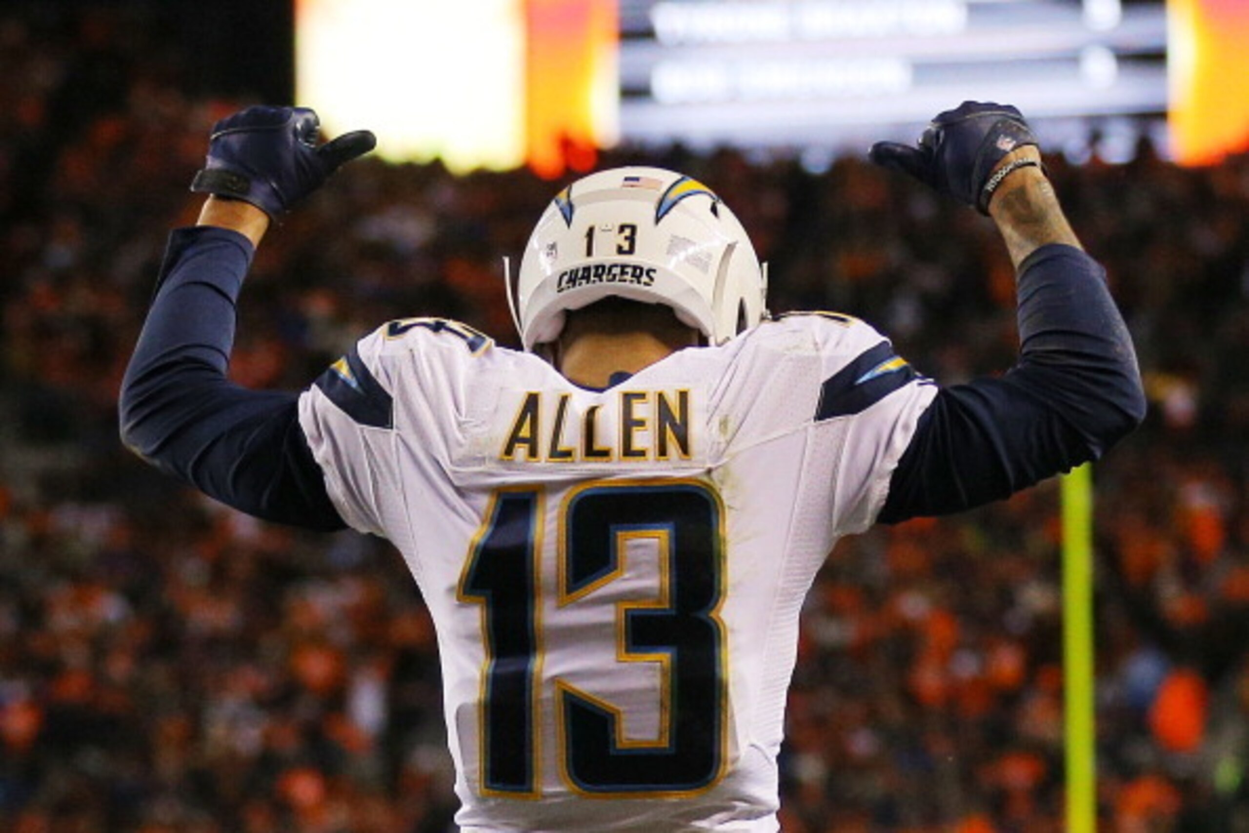 DENVER, CO - JANUARY 12:  Keenan Allen #13 of the San Diego Chargers celebrates a fourth quarter touchdown against the Denver Broncos during the AFC Divisional Playoff Game at Sports Authority Field at Mile High on January 12, 2014 in Denver, Colorado.  (