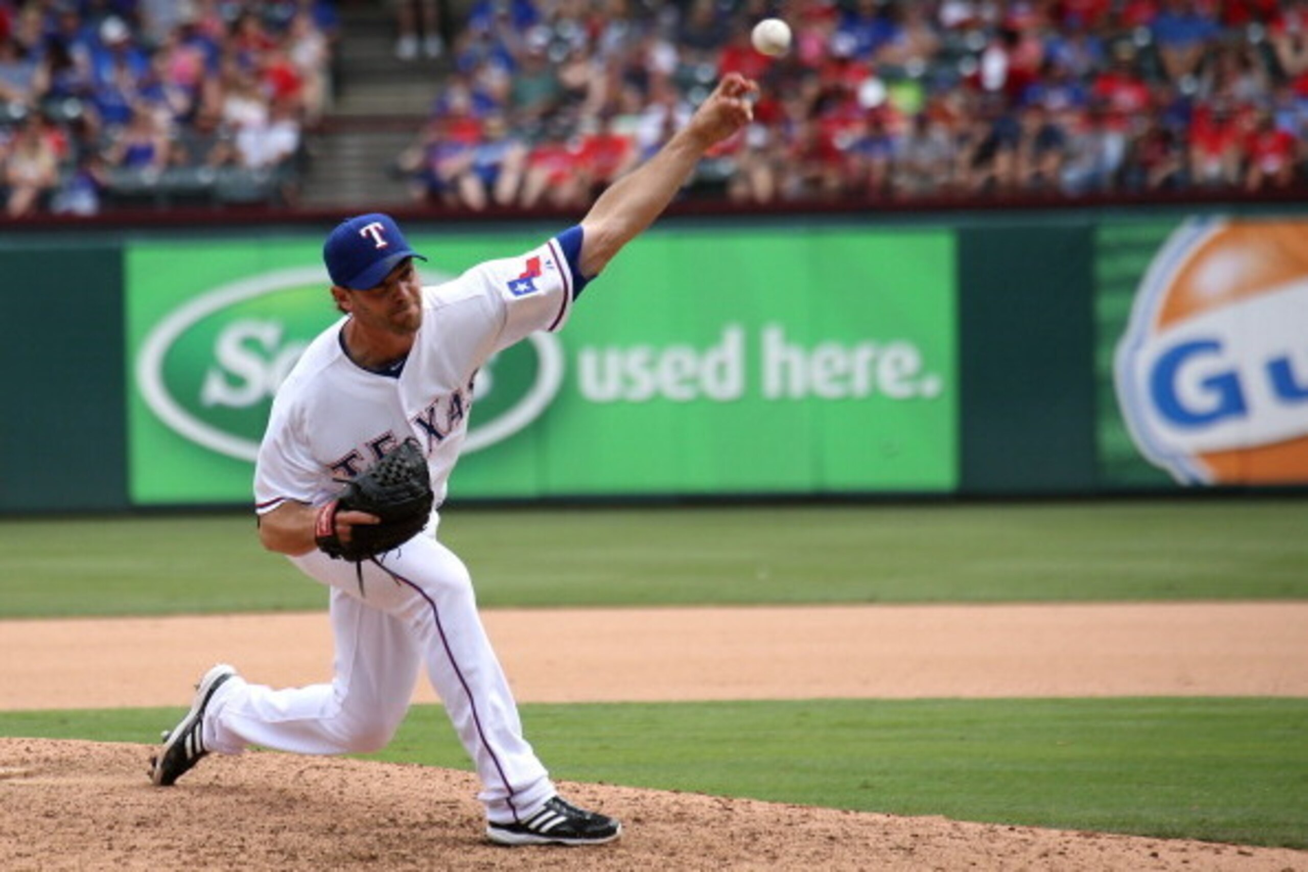 ARLINGTON, TX - JUNE 8: Neal Cotts #56 of the Texas Rangers throws in the seventh inning against the Cleveland Indians at Globe Life Park in Arlington on June 8, 2014 in Arlington, Texas.  (Photo by Rick Yeatts/Getty Images)