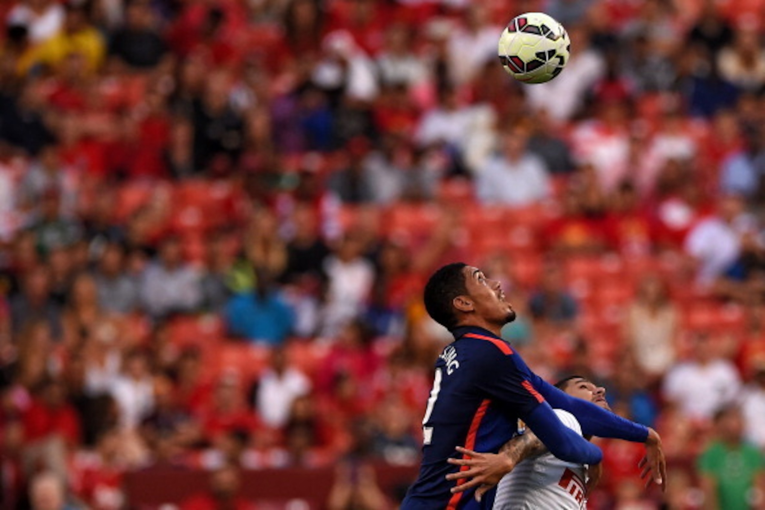 LANDOVER, MD - JULY 29: Chris Smalling #12 of Manchester United battles with Mauro Andreolli #9 of Inter Milan for the ball in the first half during their match in the International Champions Cup 2014 at FedExField on July 29, 2014 in Landover, Maryland LANDOVER, MD - JULY 29: Chris Smalling #12 of Manchester United battles with Mauro Andreolli #9 of Inter Milan for the ball in the first half during their match in the International Champions Cup 2014 at FedExField on July 29, 2014 in Landover, Maryland