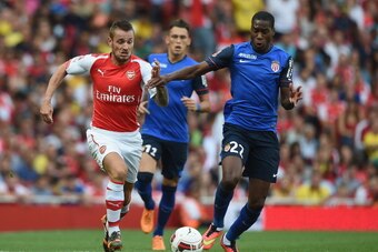 LONDON, ENGLAND - AUGUST 03: Mathieu Debuchy of Arsenal in action with Geoffrey Kondogbia of Monaco during the Emirates Cup match between Arsenal and AS Monaco at the Emirates Stadium on August 3, 2014 in London, England.  (Photo by Michael Regan/Getty Im