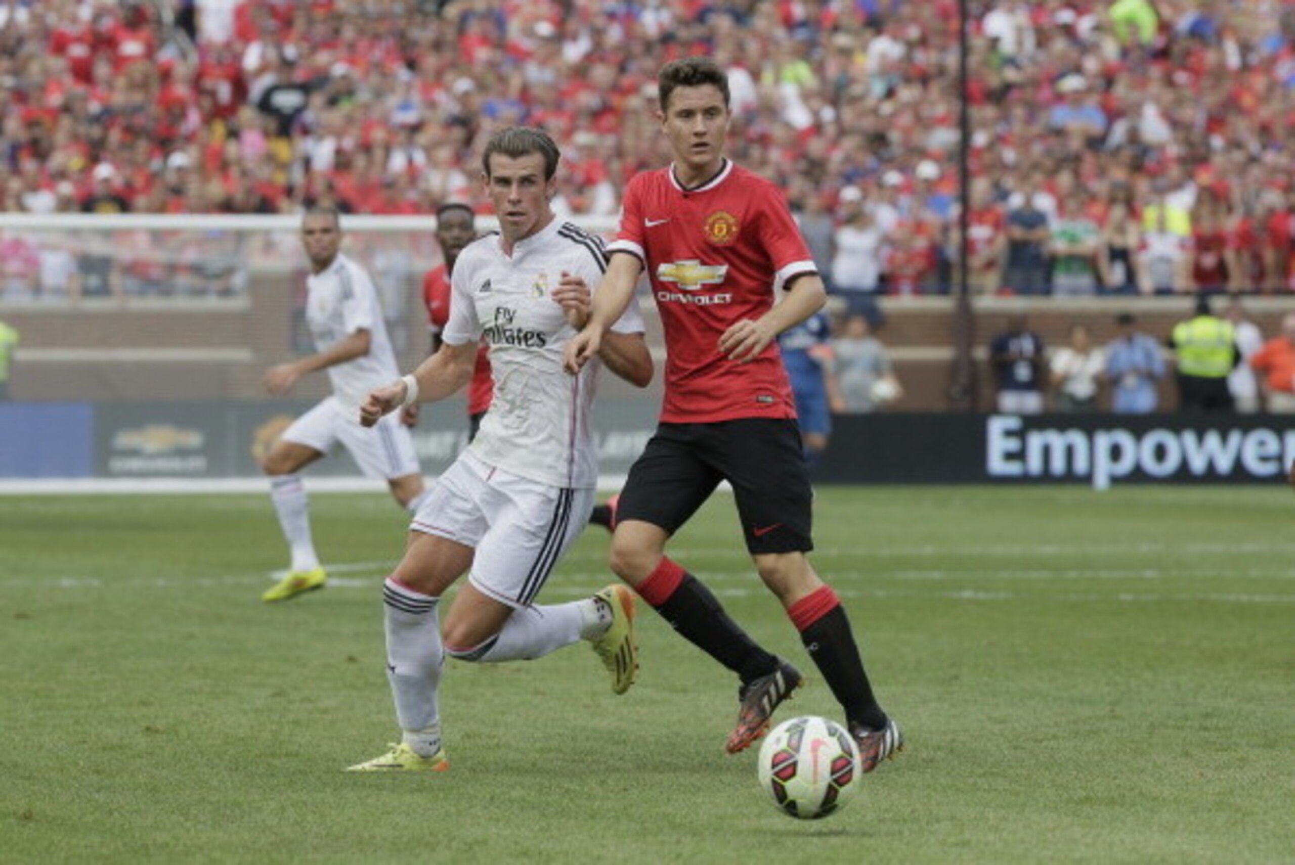 ANN ARBOR, MI - AUGUST 2: Ander Herrera #21 of Manchester United keeps the ball away from Gareth Bale #11 of Real Madrid during the first half of the Guinness International Champions Cup at Michigan Stadium on August 2, 2014, in Ann Arbor, Mich (Photo by 