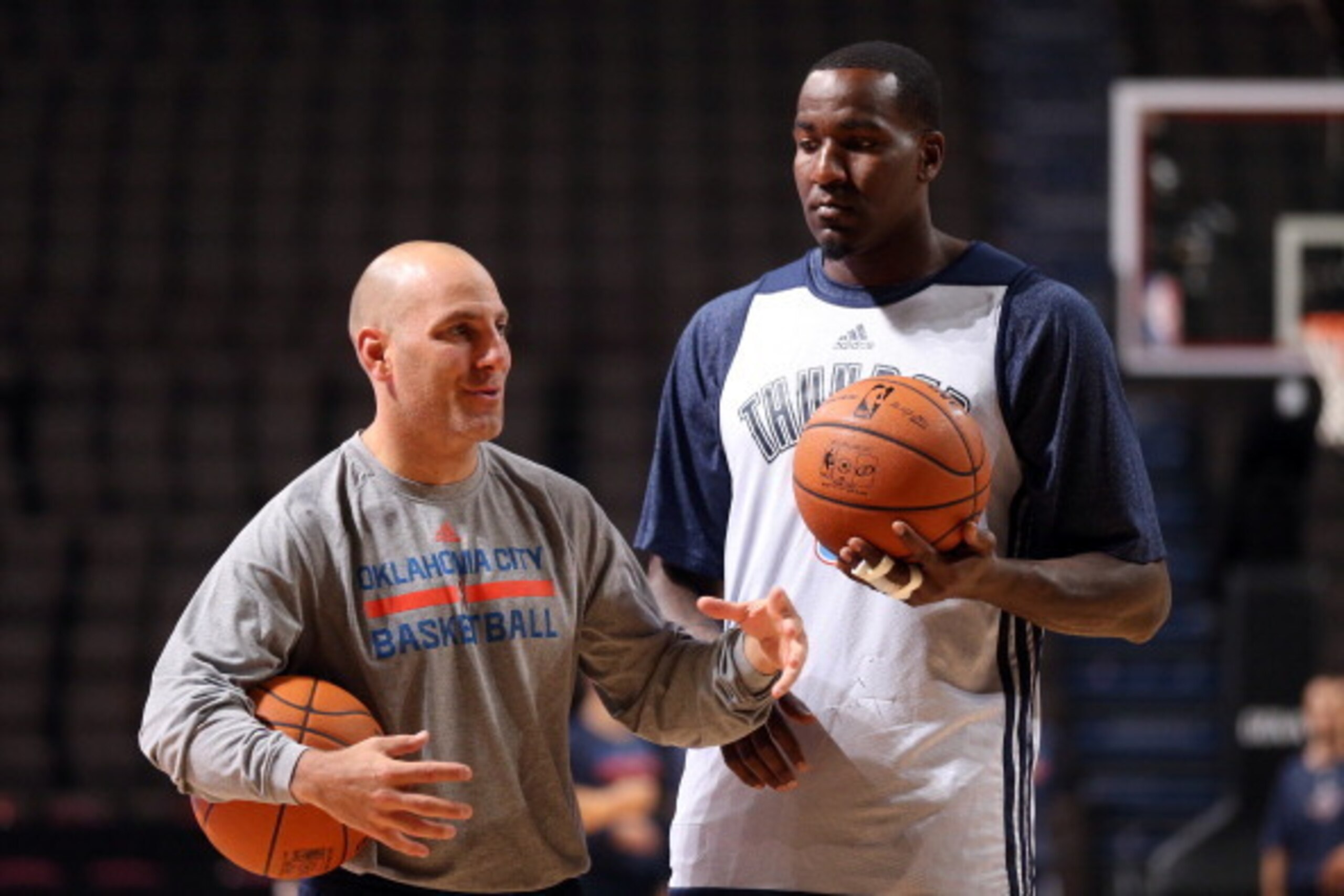 MANCHESTER, ENGLAND - OCTOBER 7:  Kendrick Perkins #5 of the Oklahoma City Thunder talks with assistant coach Rex Kalamian before their team practices for their game against the Philadelphia 76ers as part of the NBA Global Games on October 7, 2013 at the 