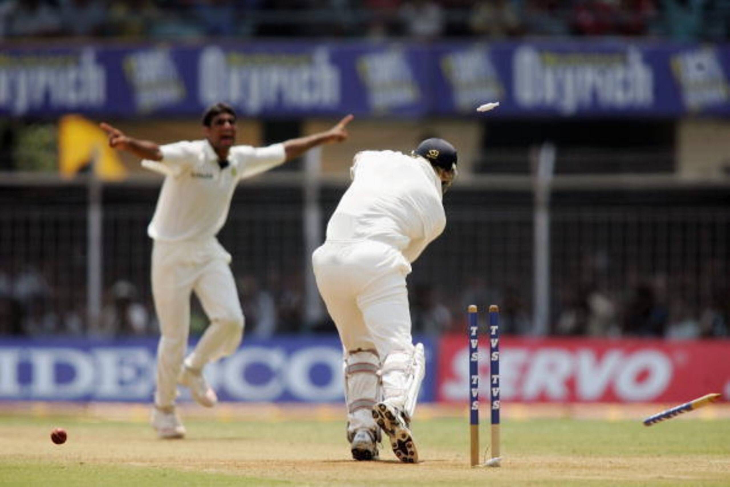 MUMBAI, INDIA - MARCH 19:  Munaf Patel of India celebrates as he bowls Matthew Hoggard of England during the second day of the Third Test between India and England at the Wankhede Stadium on March 19, 2006 in Mumbai, India.  (Photo by Ben Radford/Getty Im