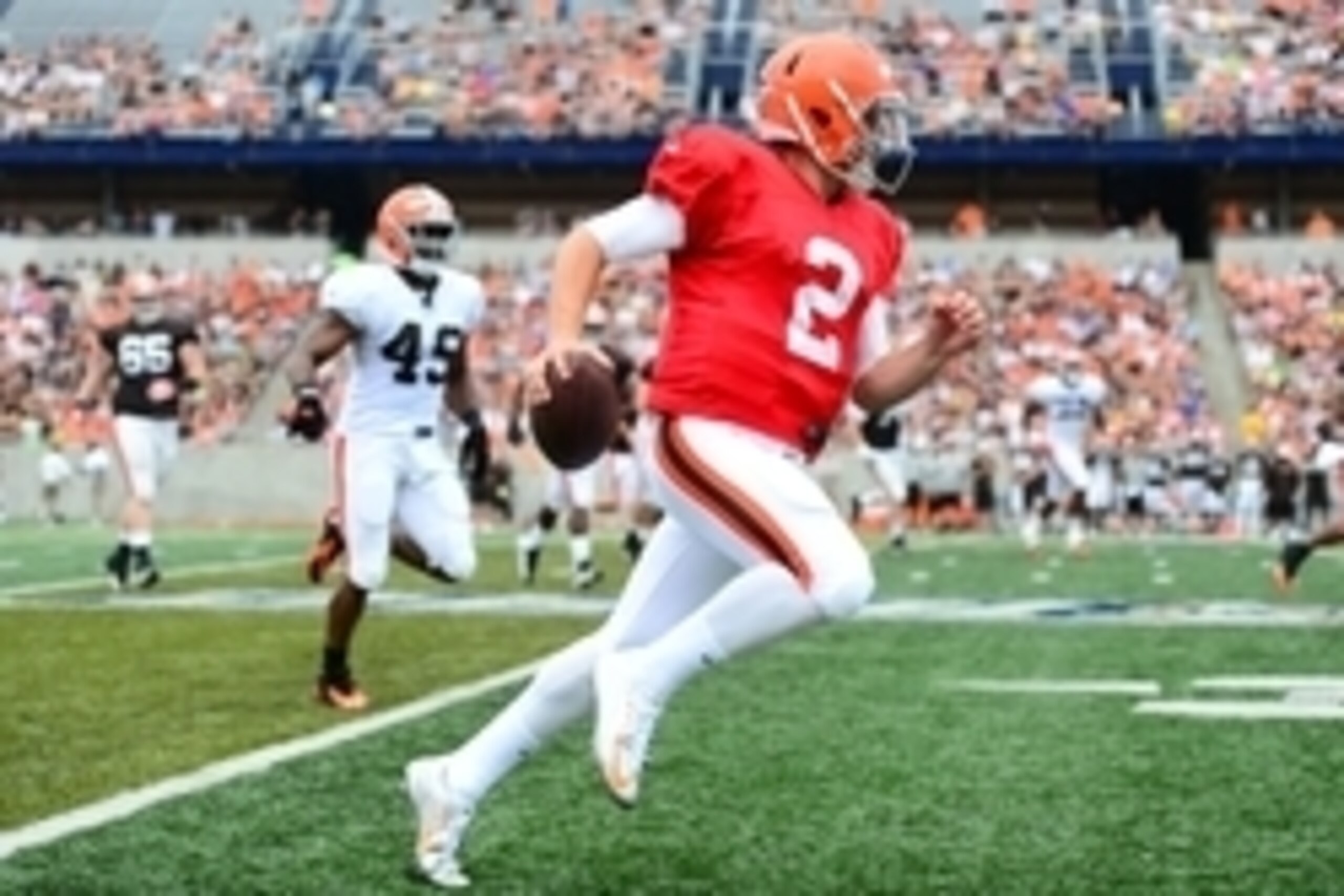Aug 2, 2014; Akron, OH, USA; Cleveland Browns quarterback Johnny Manziel (2) runs the ball during training camp at InfoCision Stadium   Summa Field. Mandatory Credit: Andrew Weber-USA TODAY Sports