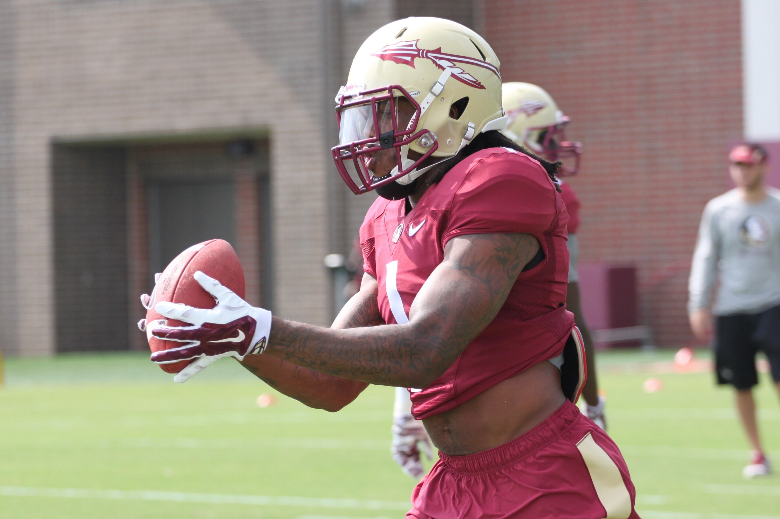 Ermon Lane grabs a pass during practice this week.