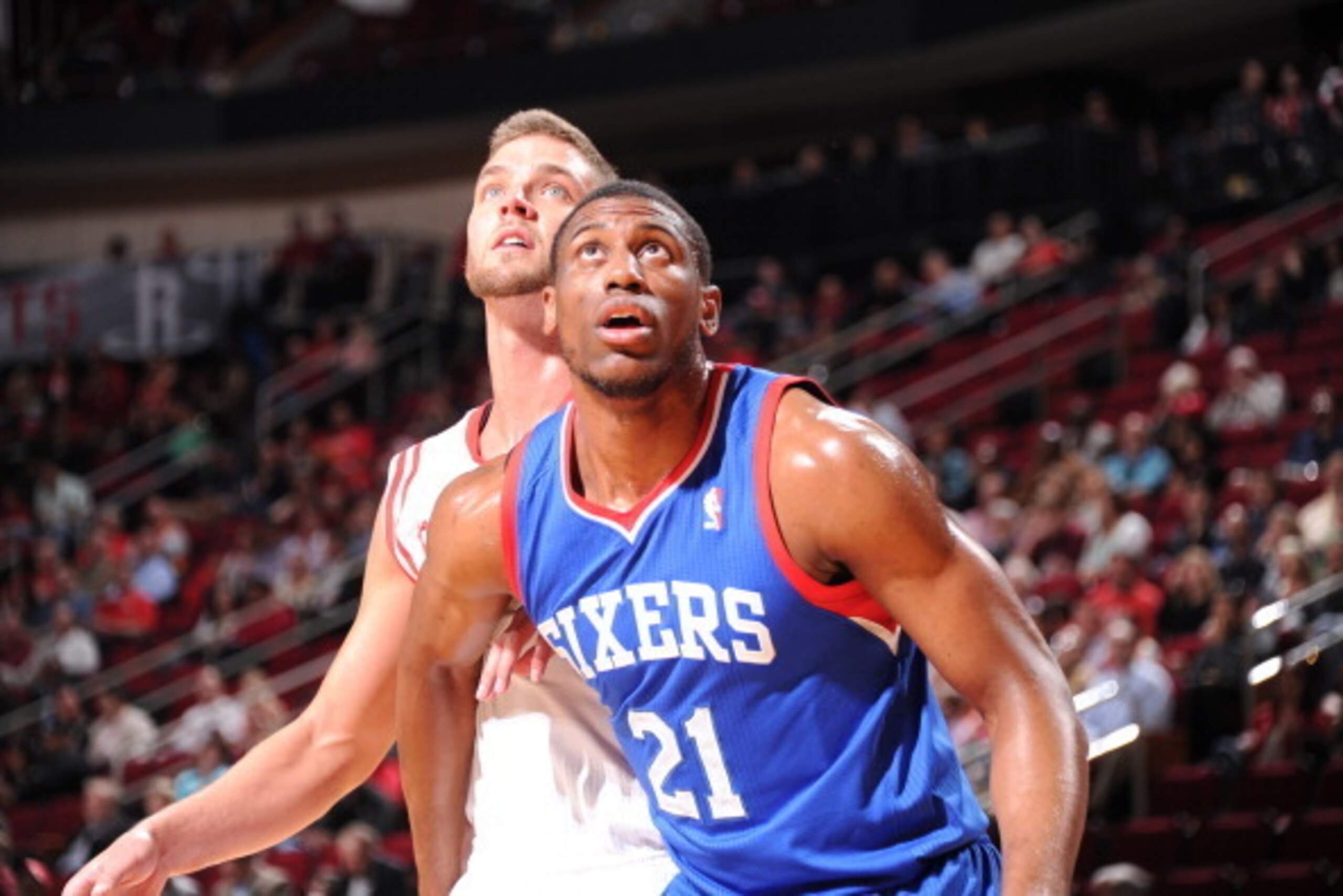 HOUSTON, TX - MARCH 27:  Thaddeus Young #21 of the Philadelphia 76ers and Chandler Parsons #25 of the Houston Rockets battle for the rebound on March 27, 2014 at the Toyota Center in Houston, Texas. NOTE TO USER: User expressly acknowledges and agrees tha