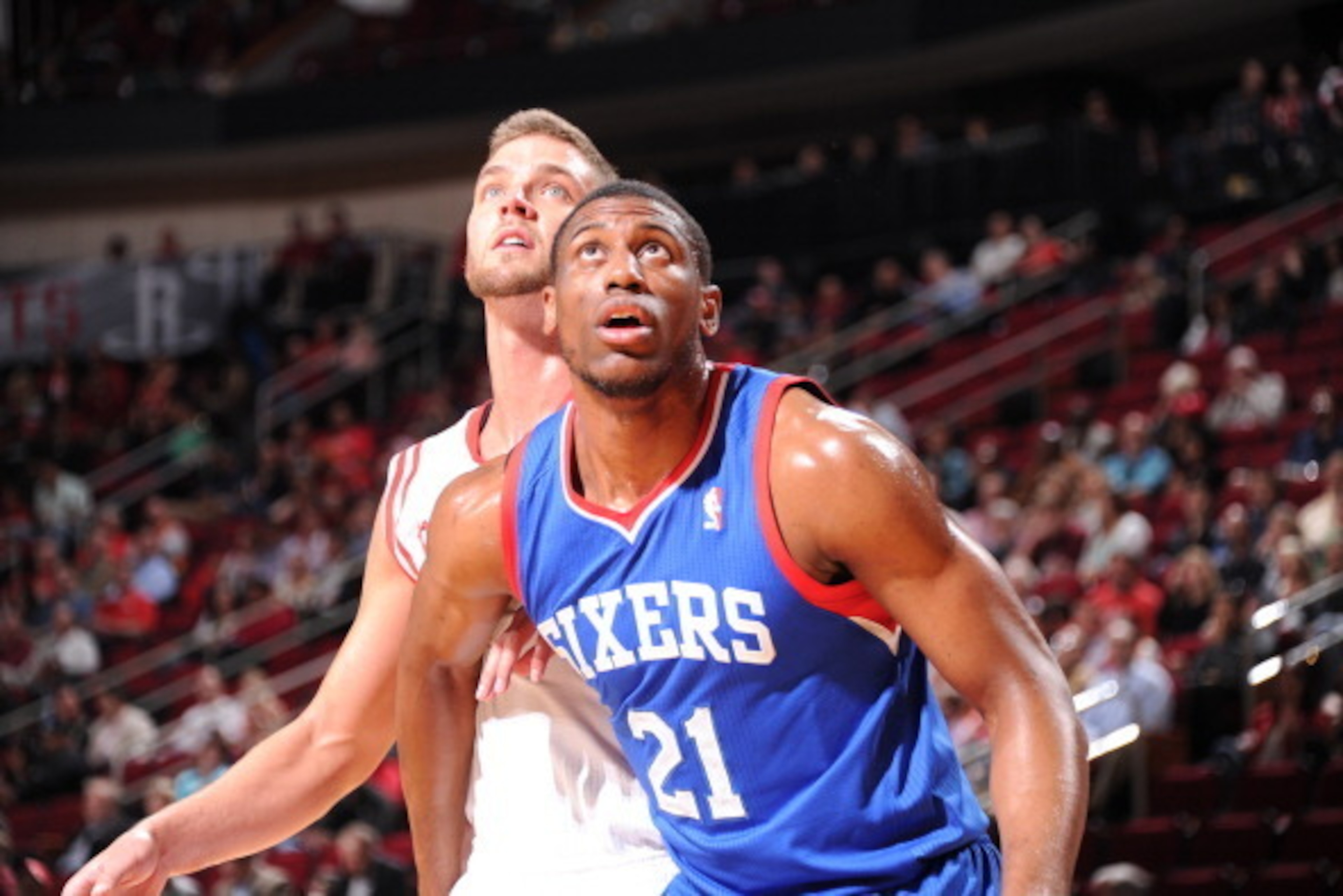 HOUSTON, TX - MARCH 27:  Thaddeus Young #21 of the Philadelphia 76ers and Chandler Parsons #25 of the Houston Rockets battle for the rebound on March 27, 2014 at the Toyota Center in Houston, Texas. NOTE TO USER: User expressly acknowledges and agrees tha