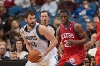 Dec 11, 2013; Minneapolis, MN, USA; Minnesota Timberwolves power forward Kevin Love (42) looks to pass in the second quarter against the Philadelphia 76ers power forward Thaddeus Young (21) at Target Center. Mandatory Credit: Brad Rempel-USA TODAY Sports