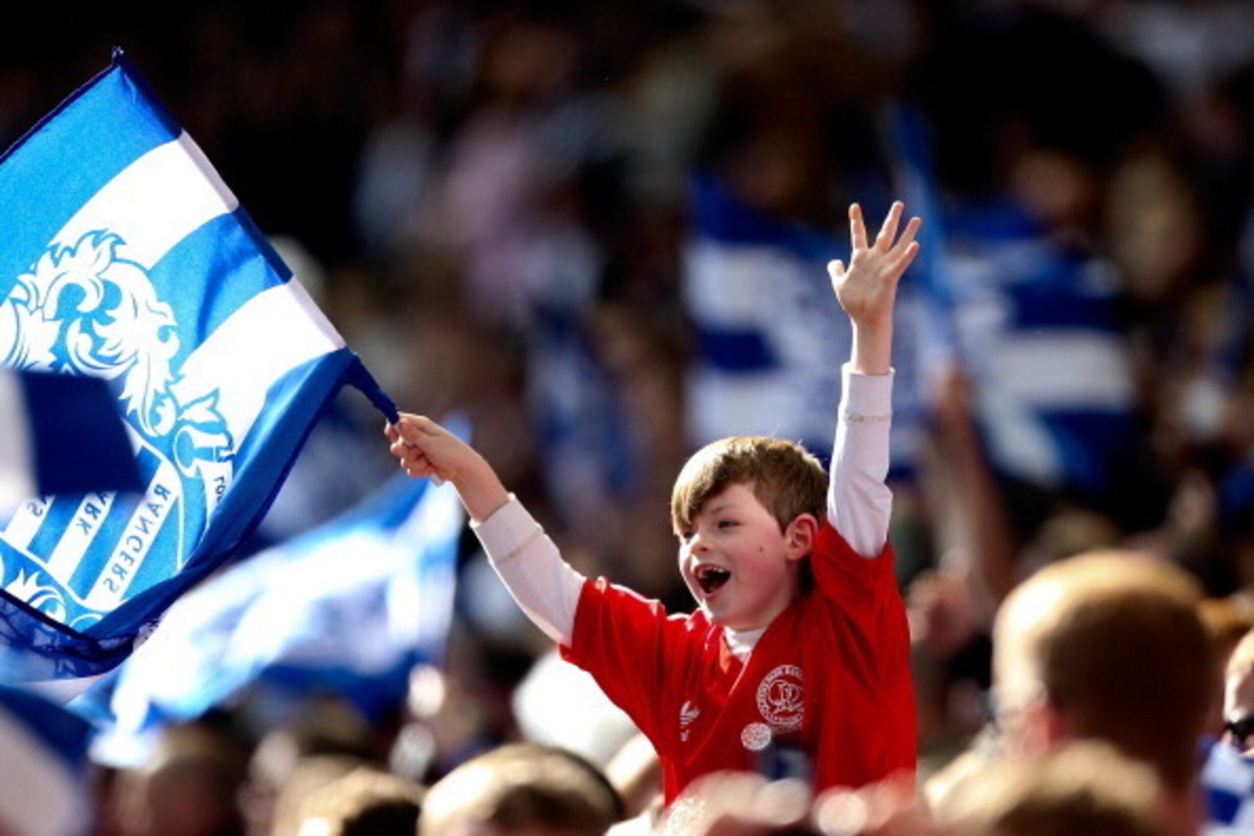 LONDON, ENGLAND - MAY 24: A young QPR fan celebrates his team's victory during the Sky Bet Championship Playoff Final match between Derby County and Queens Park Rangers at Wembley Stadium on May 24, 2014 in London, England.  (Photo by Ben Hoskins/Getty Im
