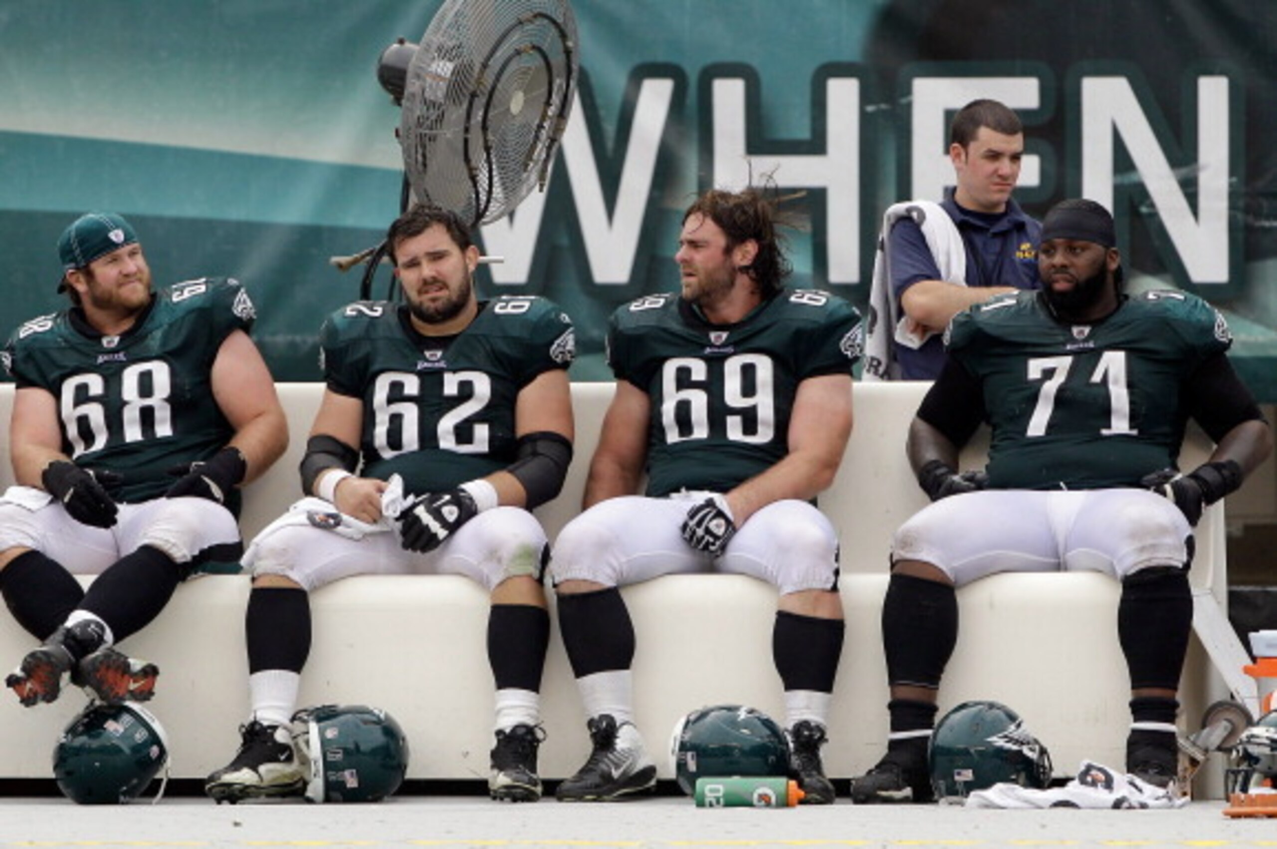 PHILADELPHIA, PA - SEPTEMBER 25: Offensive players  Kyle DeVan #68, Jason Kelce #62, Evan Mathis #69, and Jason Peters #71 of the Philadelphia Eagles sit on the bench during the fourth quarter against the New York Giants at Lincoln Financial Field on Sept