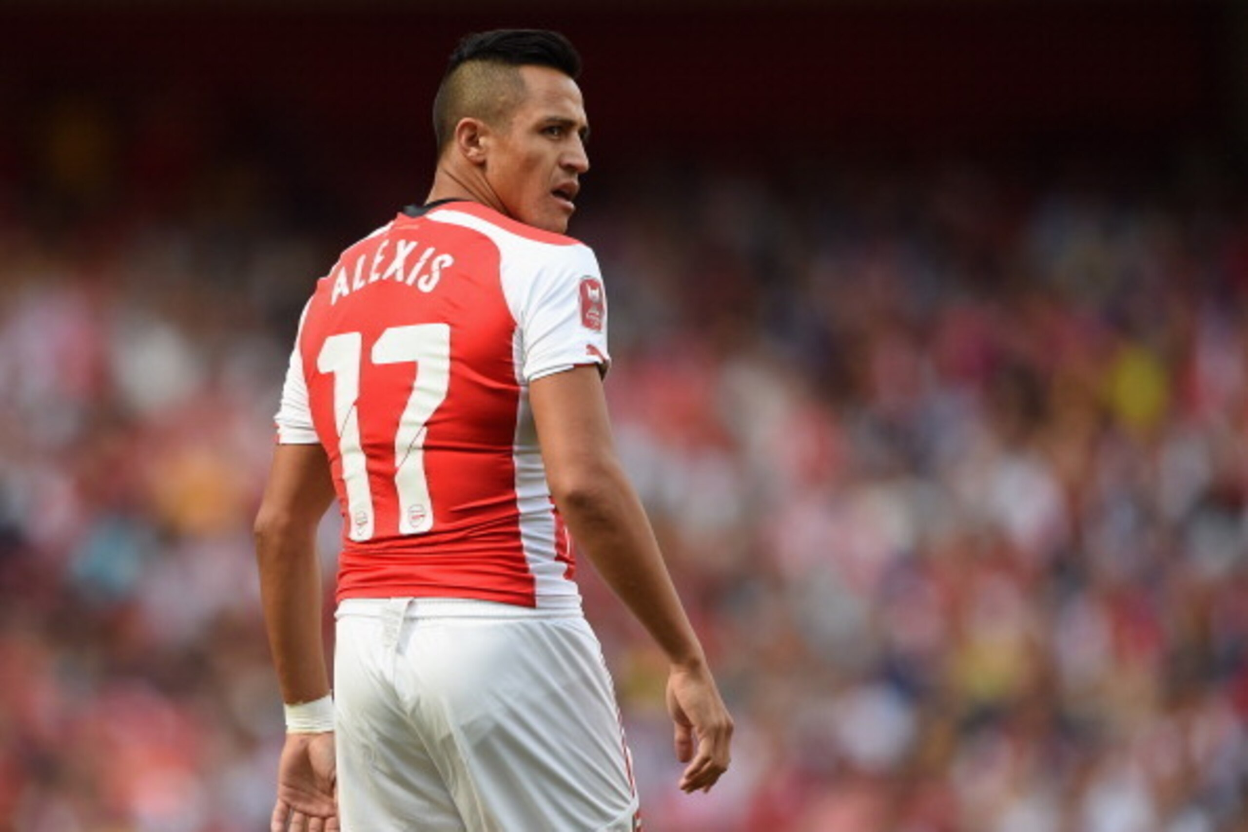 LONDON, ENGLAND - AUGUST 03:  Alexis Sanchez of Arsenal looks on during the Emirates Cup match between Arsenal and AS Monaco at the Emirates Stadium on August 3, 2014 in London, England.  (Photo by Michael Regan/Getty Images)
