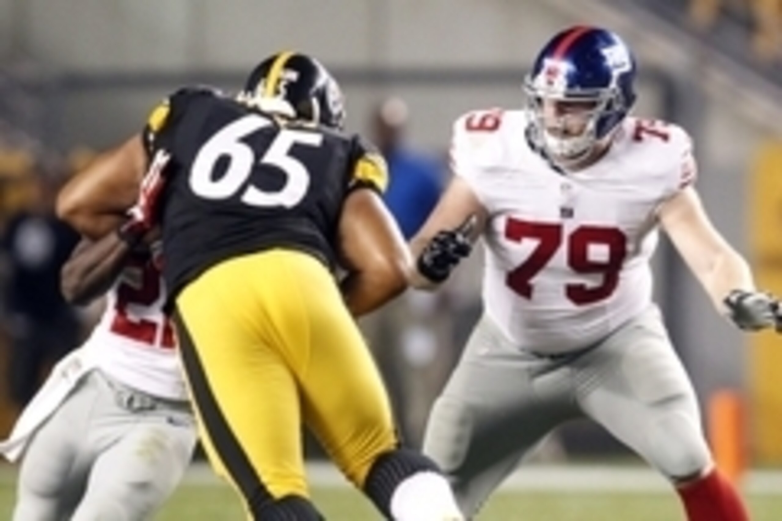 Aug 10, 2013; Pittsburgh, PA, USA; New York Giants guard Stephen Goodin (79) blocks at the line of scrimmage against Pittsburgh Steelers defensive tackle Al Woods (65) during the second quarter at Heinz Field. The New York Giants won 18-13. Mandatory Cred Aug 10, 2013; Pittsburgh, PA, USA; New York Giants guard Stephen Goodin (79) blocks at the line of scrimmage against Pittsburgh Steelers defensive tackle Al Woods (65) during the second quarter at Heinz Field. The New York Giants won 18-13. Mandatory Cred