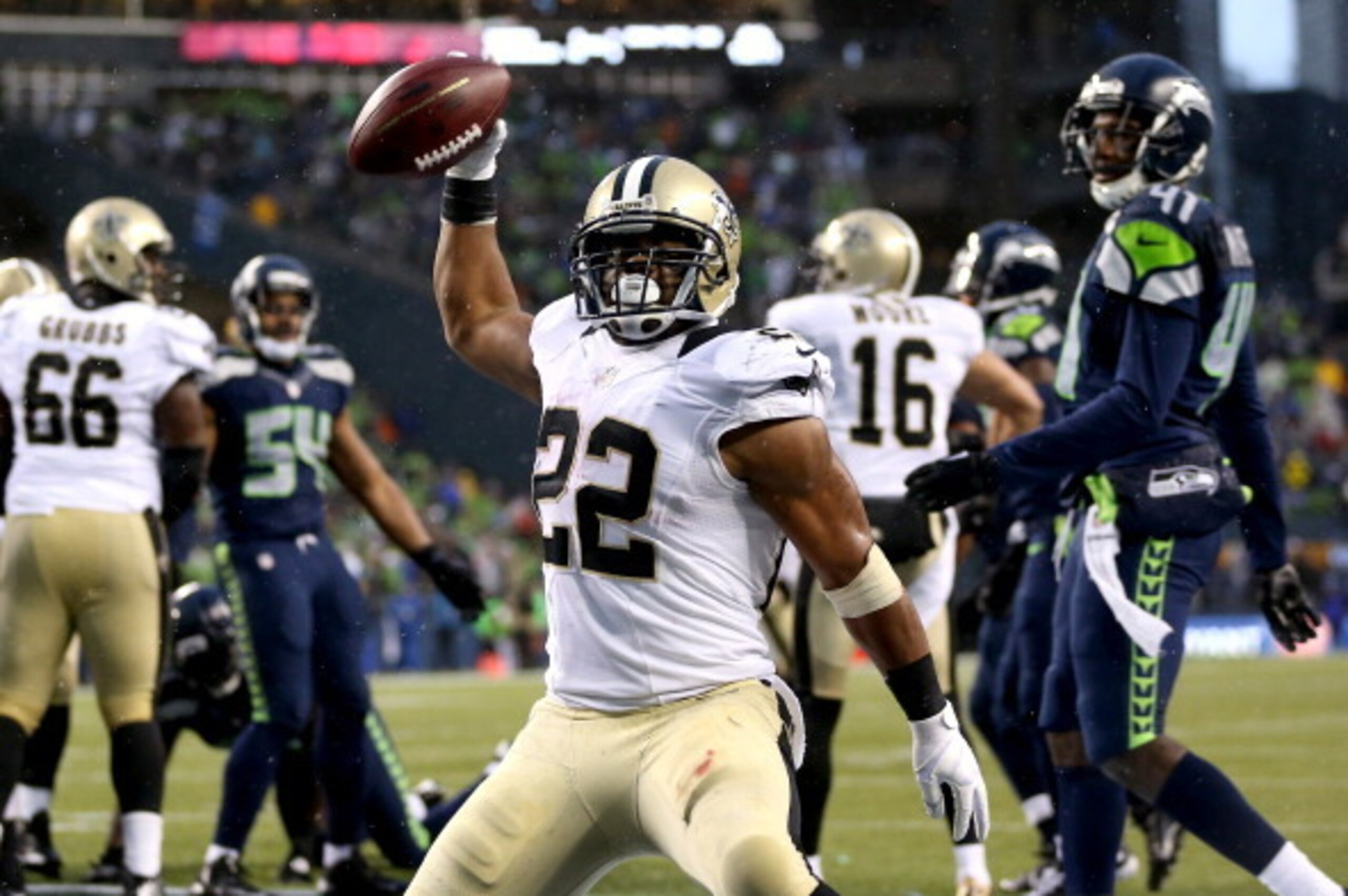 SEATTLE, WA - JANUARY 11:  Running back Mark Ingram #22 of the New Orleans Saints celebrates after scoring on a two-point conversion in the fourth quarter against the Seattle Seahawks during the NFC Divisional Playoff Game at CenturyLink Field on January 
