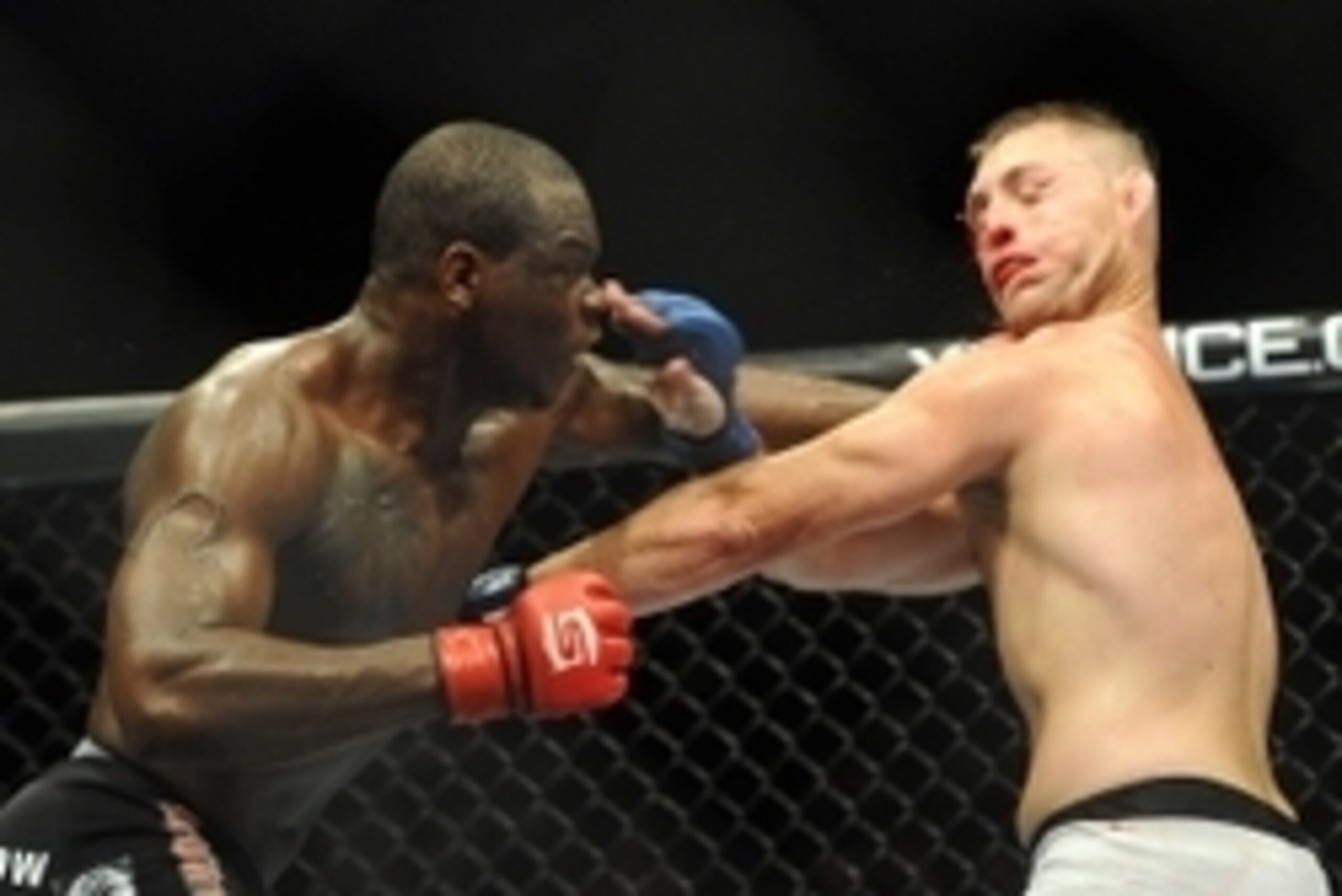 August 18, 2012; San Diego, CA, USA;     Ovince St. Preux (black shorts) fights TJ Cook (white shorts) in their Strikeforce MMA Light Heavyweight Bout at the Valley View Casino Center. Mandatory Credit: Jayne Kamin-Oncea-USA TODAY Sports