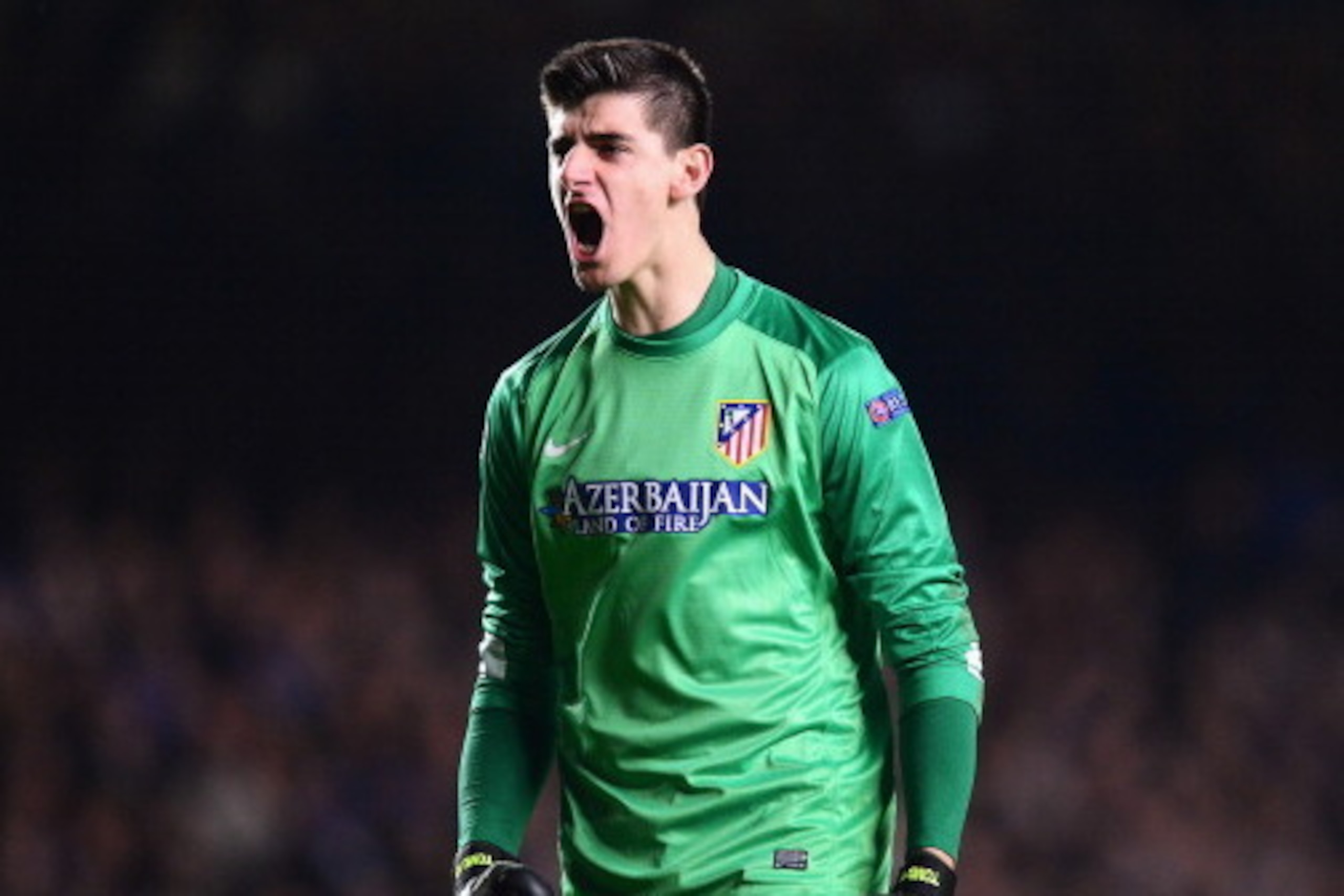 LONDON, ENGLAND - APRIL 30: Goalkeeper Thibaut Courtois of Club Atletico de Madrid celebrates a goal during the UEFA Champions League semi-final second leg match between Chelsea and Club Atletico de Madrid at Stamford Bridge on April 30, 2014 in London, E