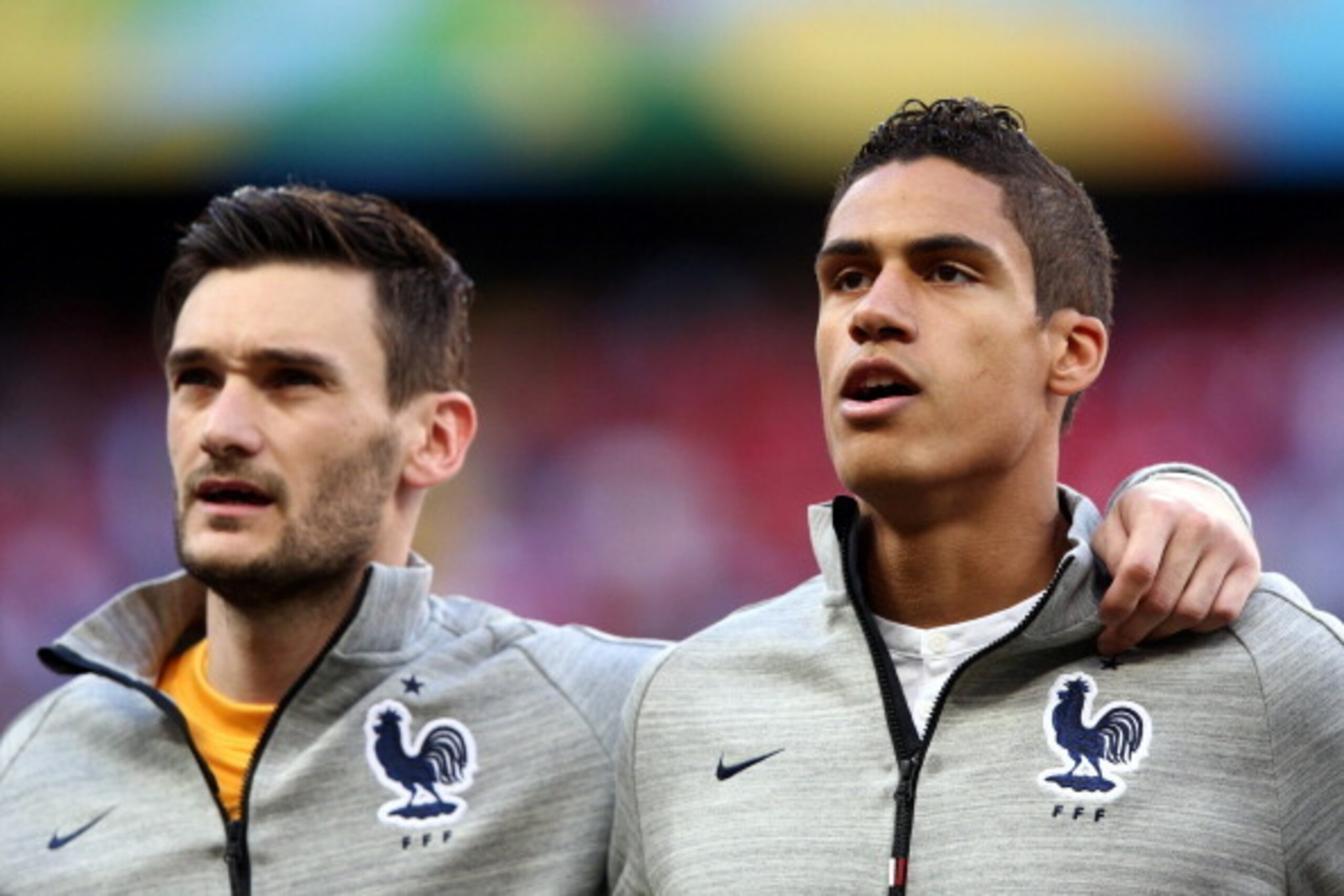 SALVADOR, BRAZIL - JUNE 20:  Hugo Lloris (L) and Raphael Varane of France look on during the National Anthem prior to the 2014 FIFA World Cup Brazil Group E match between Switzerland and France at Arena Fonte Nova on June 20, 2014 in Salvador, Brazil.  (P