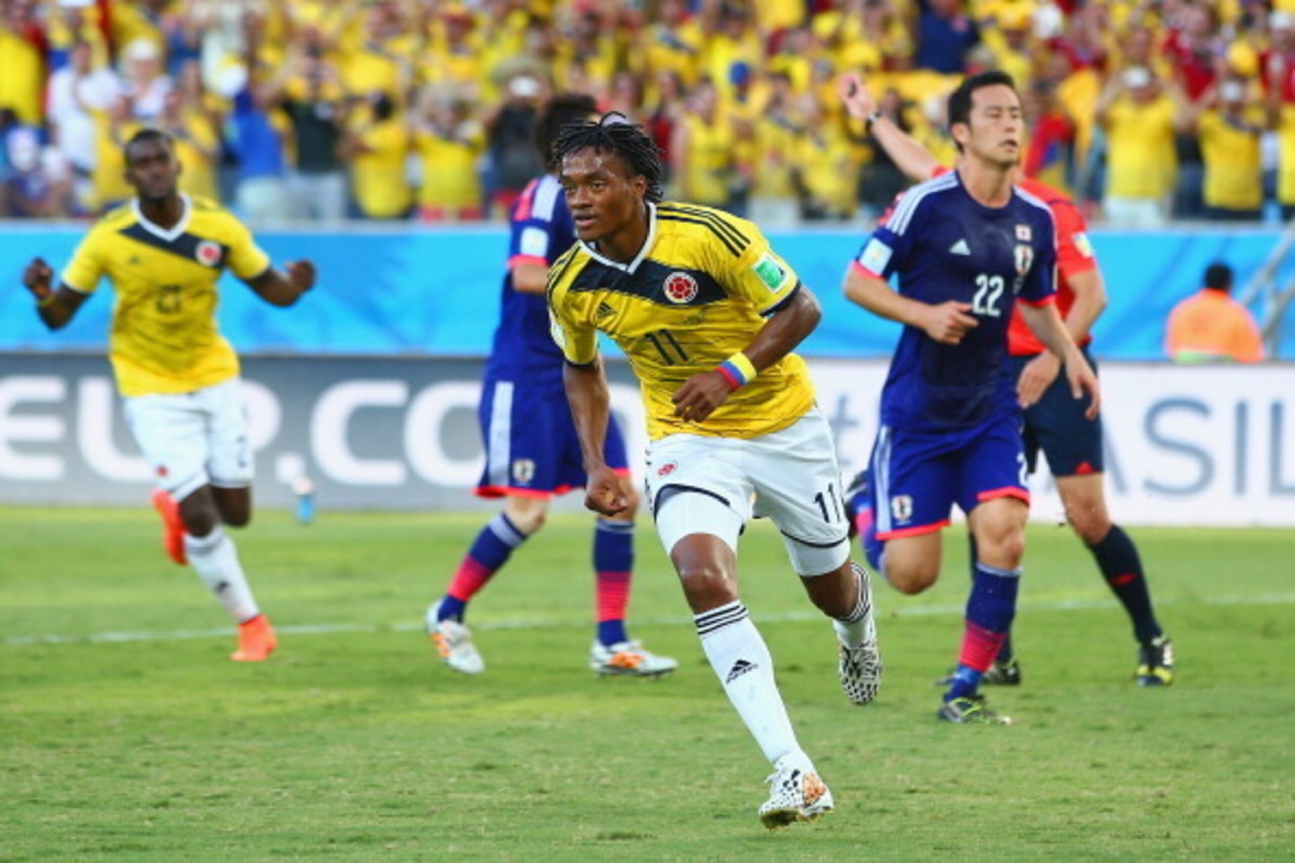 CUIABA, BRAZIL - JUNE 24: Juan Guillermo Cuadrado of Colombia celebrates scoring his team's first goal after a penalty kick during the 2014 FIFA World Cup Brazil Group C match between Japan and Colombia at Arena Pantanal on June 24, 2014 in Cuiaba, Brazi CUIABA, BRAZIL - JUNE 24: Juan Guillermo Cuadrado of Colombia celebrates scoring his team's first goal after a penalty kick during the 2014 FIFA World Cup Brazil Group C match between Japan and Colombia at Arena Pantanal on June 24, 2014 in Cuiaba, Brazi