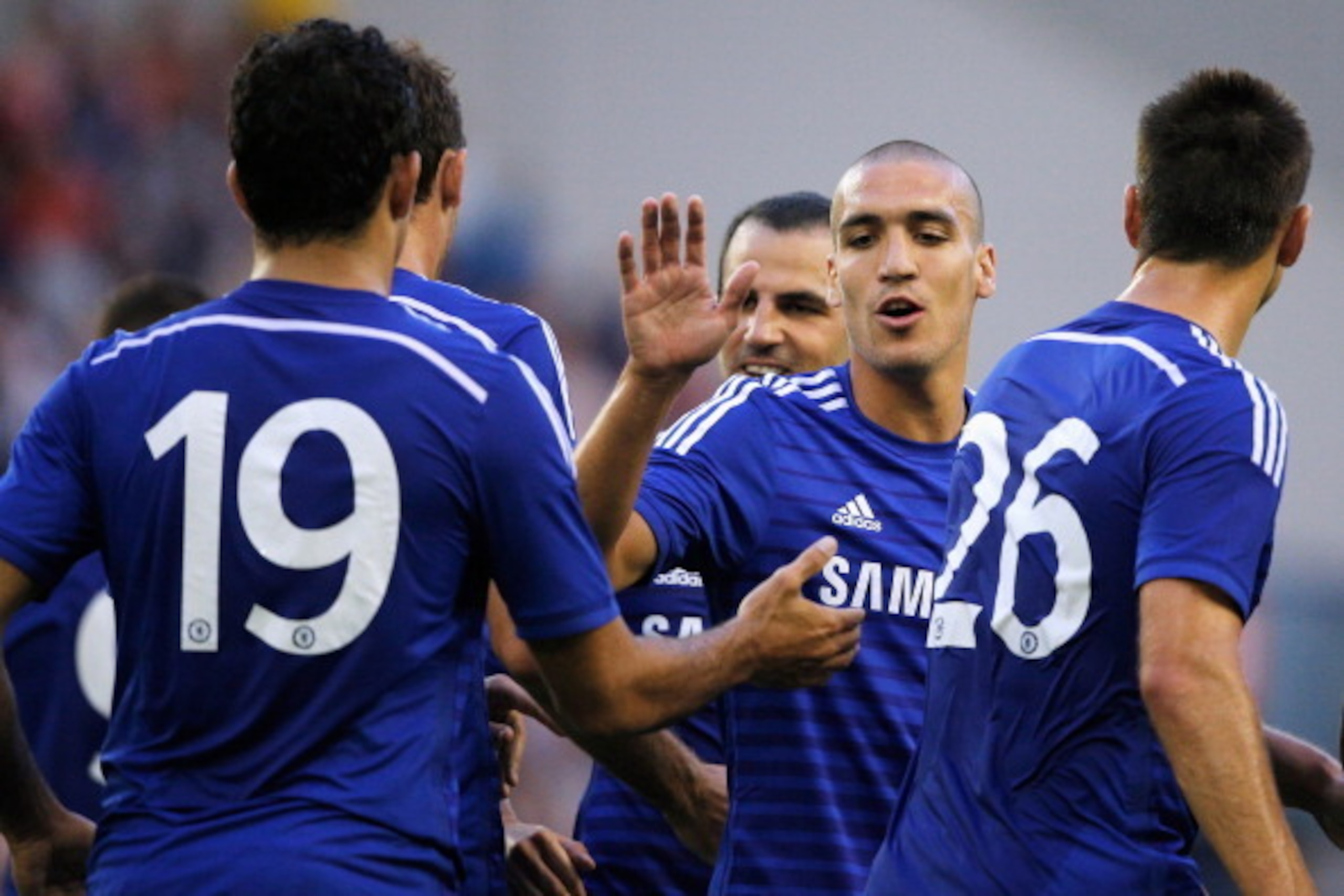 ARNHEM, NETHERLANDS - JULY 30:  Oriol Romeu (C) of Chelsea congratulates goal scorer, Nemanja Matic during the pre season friendly match between Vitesse Arnhem and Chelsea at the Gelredome Stadium on July 30, 2014 in Arnhem, Netherlands.  (Photo by Dean M