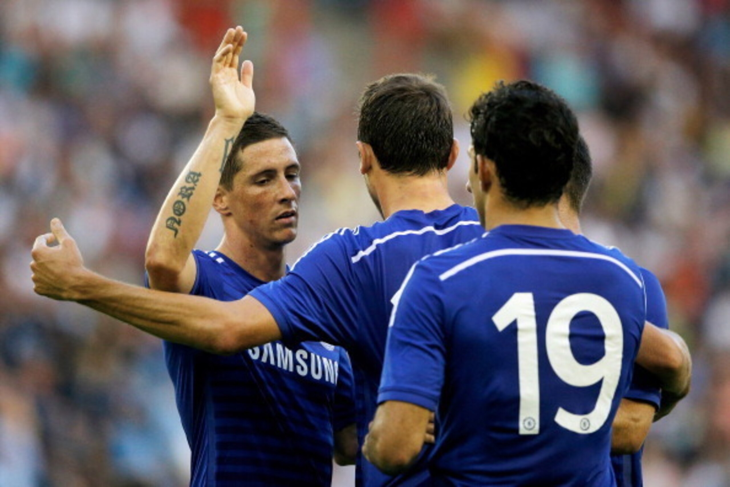 ARNHEM, NETHERLANDS - JULY 30:  Fernando Torres (L) of Chelsea congratulates goal scorer, Nemanja Matic (C) during the pre season friendly match between Vitesse Arnhem and Chelsea at the Gelredome Stadium on July 30, 2014 in Arnhem, Netherlands.  (Photo b