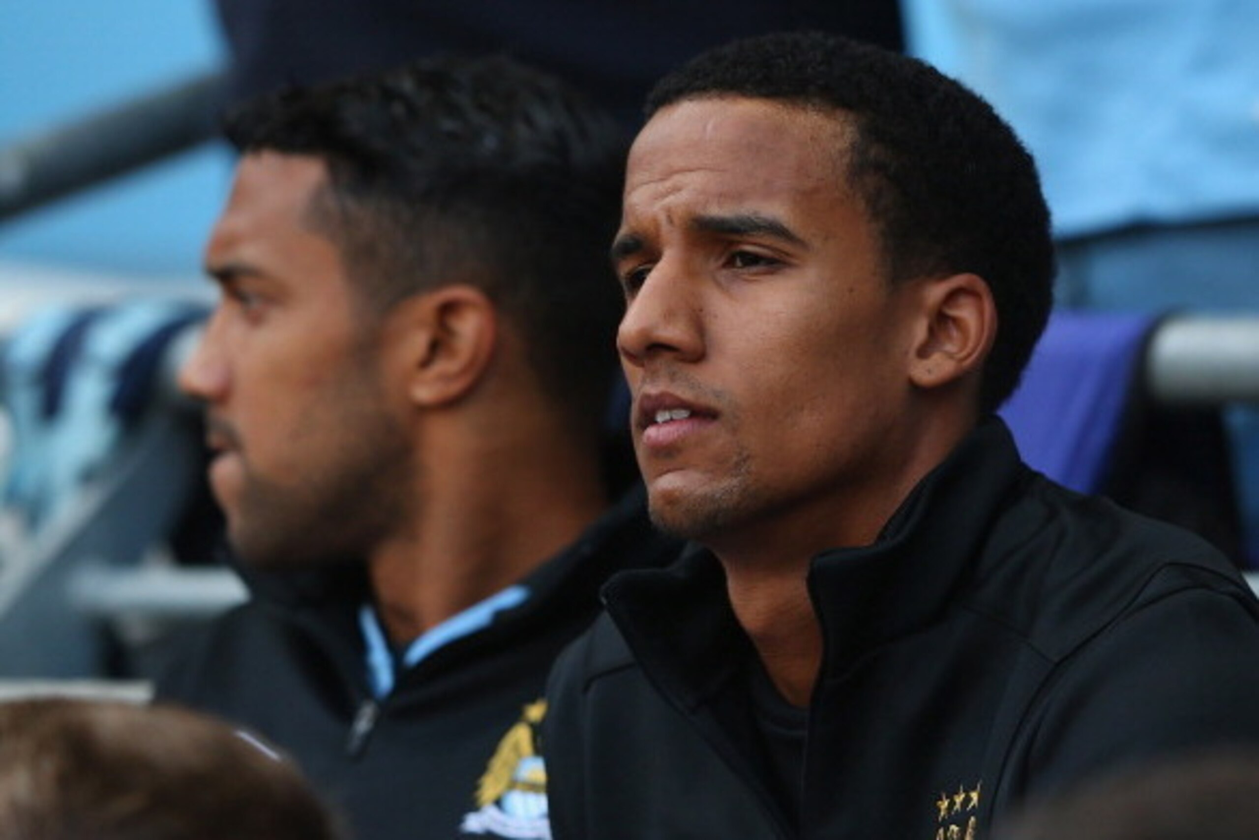 MANCHESTER, ENGLAND - SEPTEMBER 01:  New signing Scott Sinclair of Manchester City watches from the bench during the Barclays Premier League match between Manchester City and Queens Park Rangers at Etihad Stadium on September 1, 2012 in Manchester, Englan