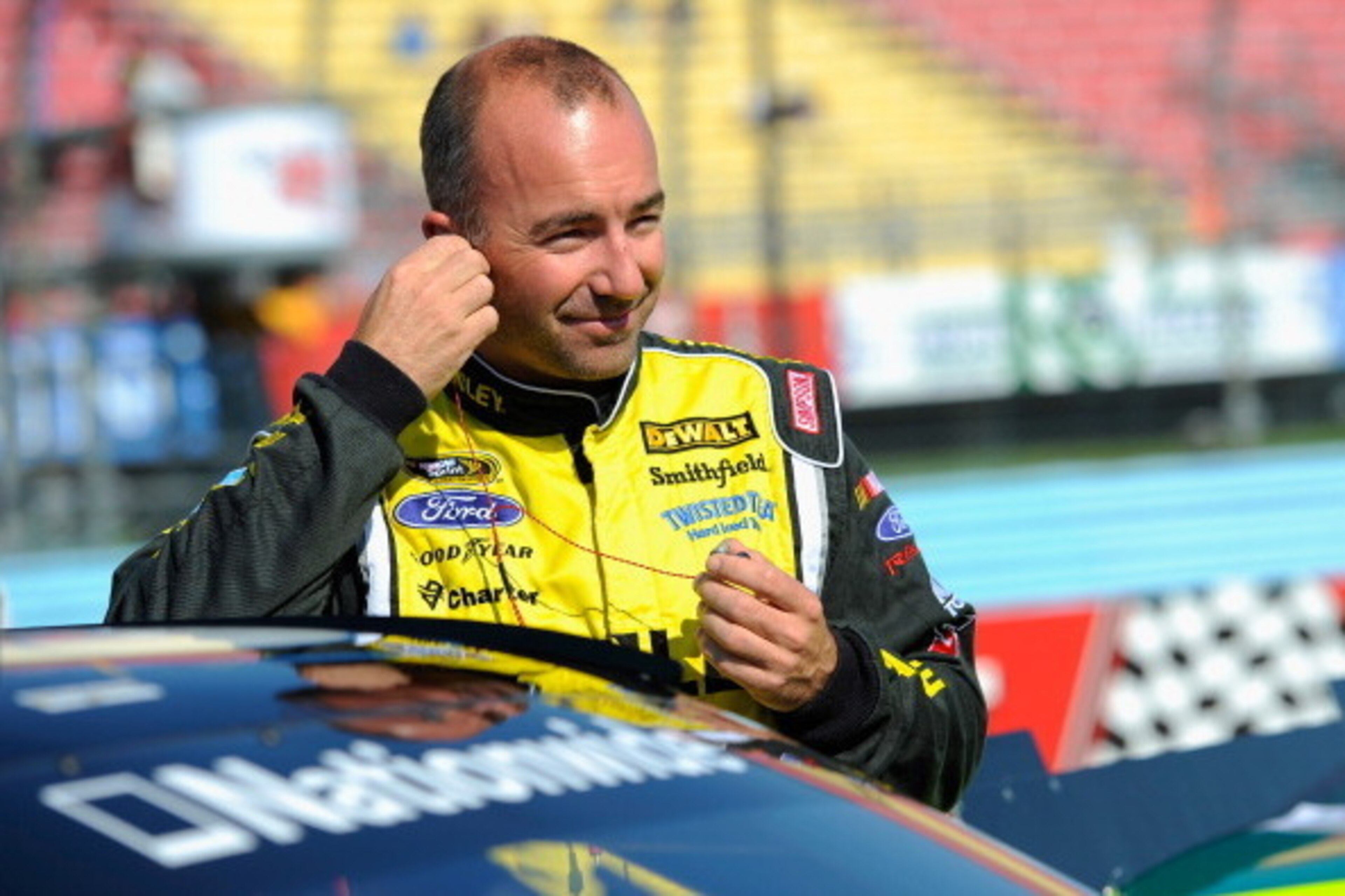 WATKINS GLEN, NY - AUGUST 09:  Marcos Ambrose, driver of the #09 Stanley Ford, prepares his equipment on the grid prior to qualifying for the NASCAR Nationwide Zippo 200 at Watkins Glen International on August 9, 2014 in Watkins Glen, New York.  (Photo by