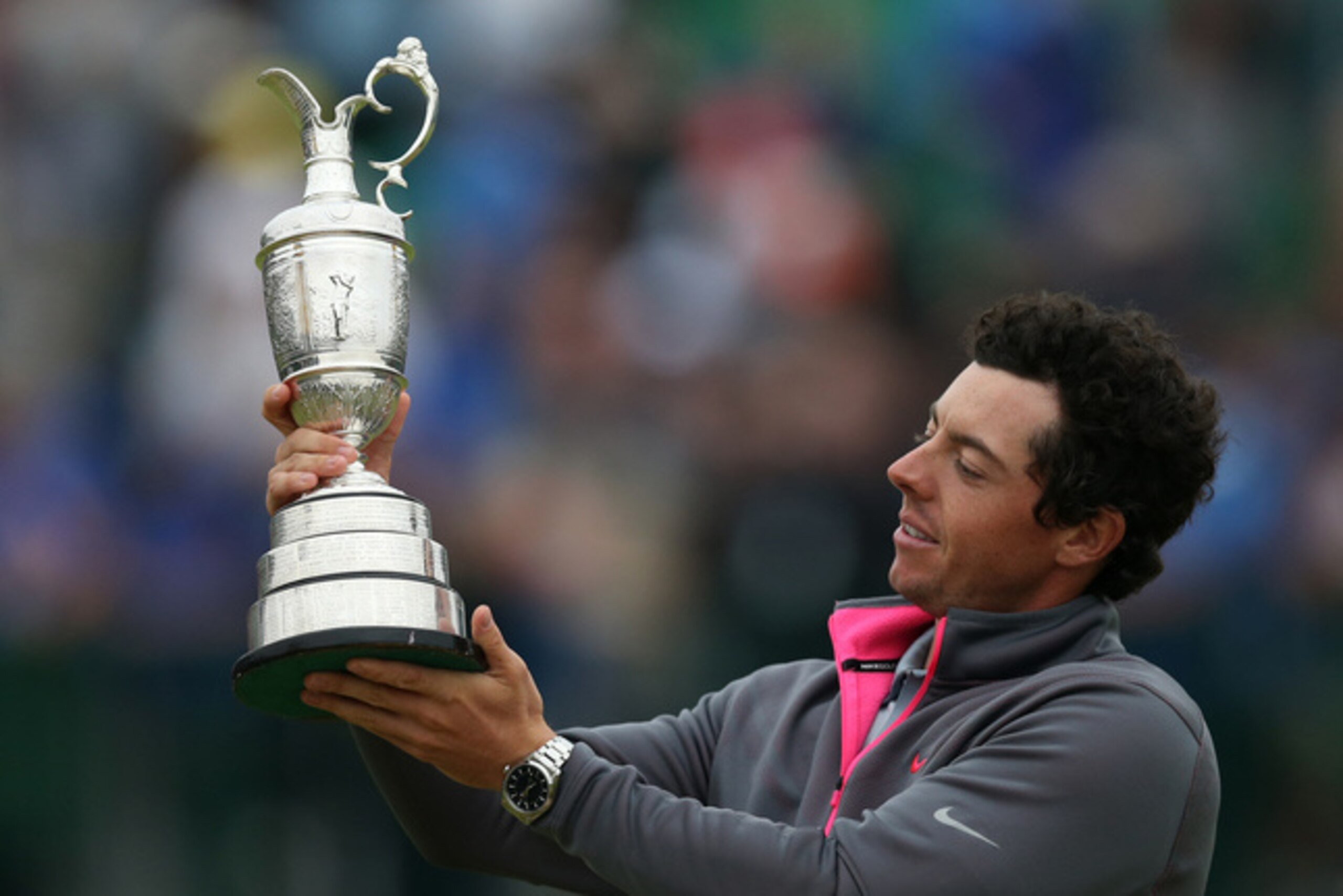 McIlroy beaming at the Claret Jug after winning the 2014 British Open.