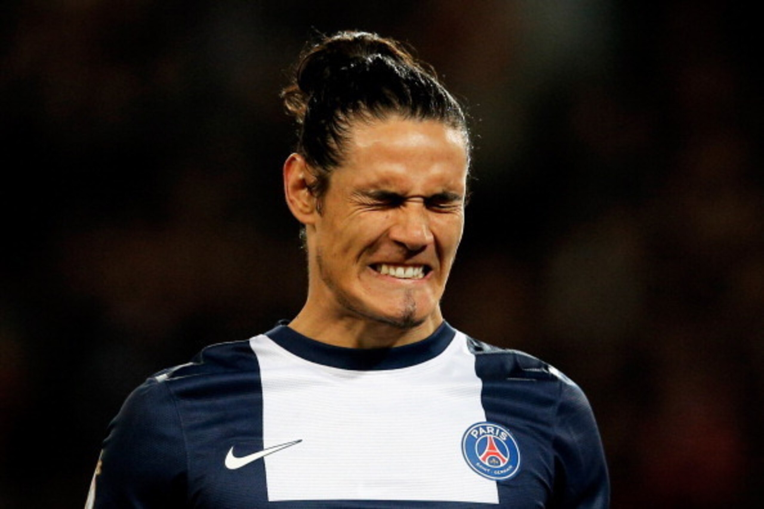 PARIS, FRANCE - MAY 07:  Edinson Cavani of PSG reacts to a missed chance on goal during the Ligue 1 match between Paris Saint-Germain FC and Stade Rennais FC at Parc des Princes on May 7, 2014 in Paris, France.  (Photo by Dean Mouhtaropoulos/Getty Images)