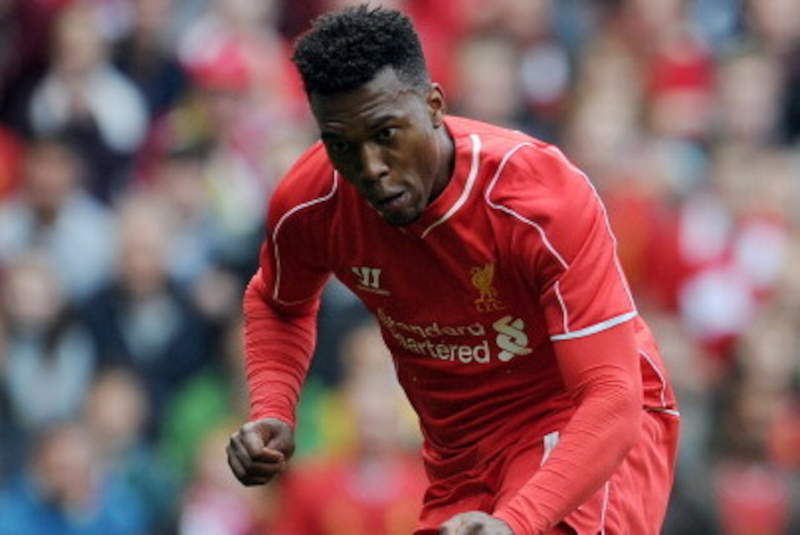 LIVERPOOL, ENGLAND - AUGUST 10:  Daniel Sturridge of Liverpool scores the first goal of the game for his side during the Pre Season Friendly match between Liverpool and Borussia Dortmund at Anfield on August 10, 2014 in Liverpool, England. (Photo by Clint