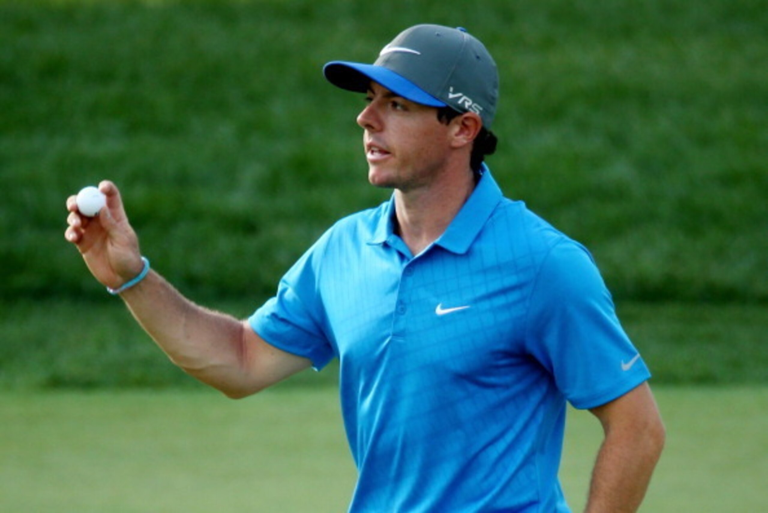 LOUISVILLE, KY - AUGUST 09: Rory McIlroy of Northern Ireland waves on the 16th green during the third round of the 96th PGA Championship at Valhalla Golf Club on August 9, 2014 in Louisville, Kentucky.  (Photo by Warren Little/Getty Images)
