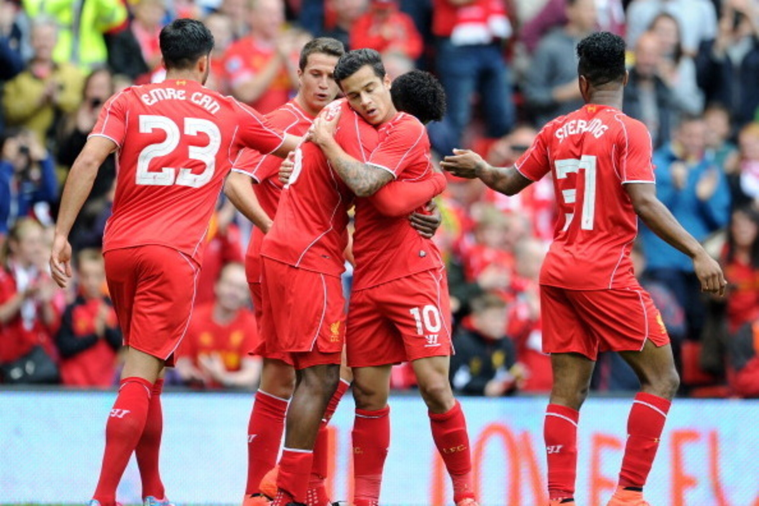 LIVERPOOL, ENGLAND - AUGUST 10:  Daniel Sturridge (C) of Liverpool celebrates with team-mate Philippe Coutinho after he scores the first goal of the game for his side during the Pre Season Friendly match between Liverpool and Borussia Dortmund at Anfield 