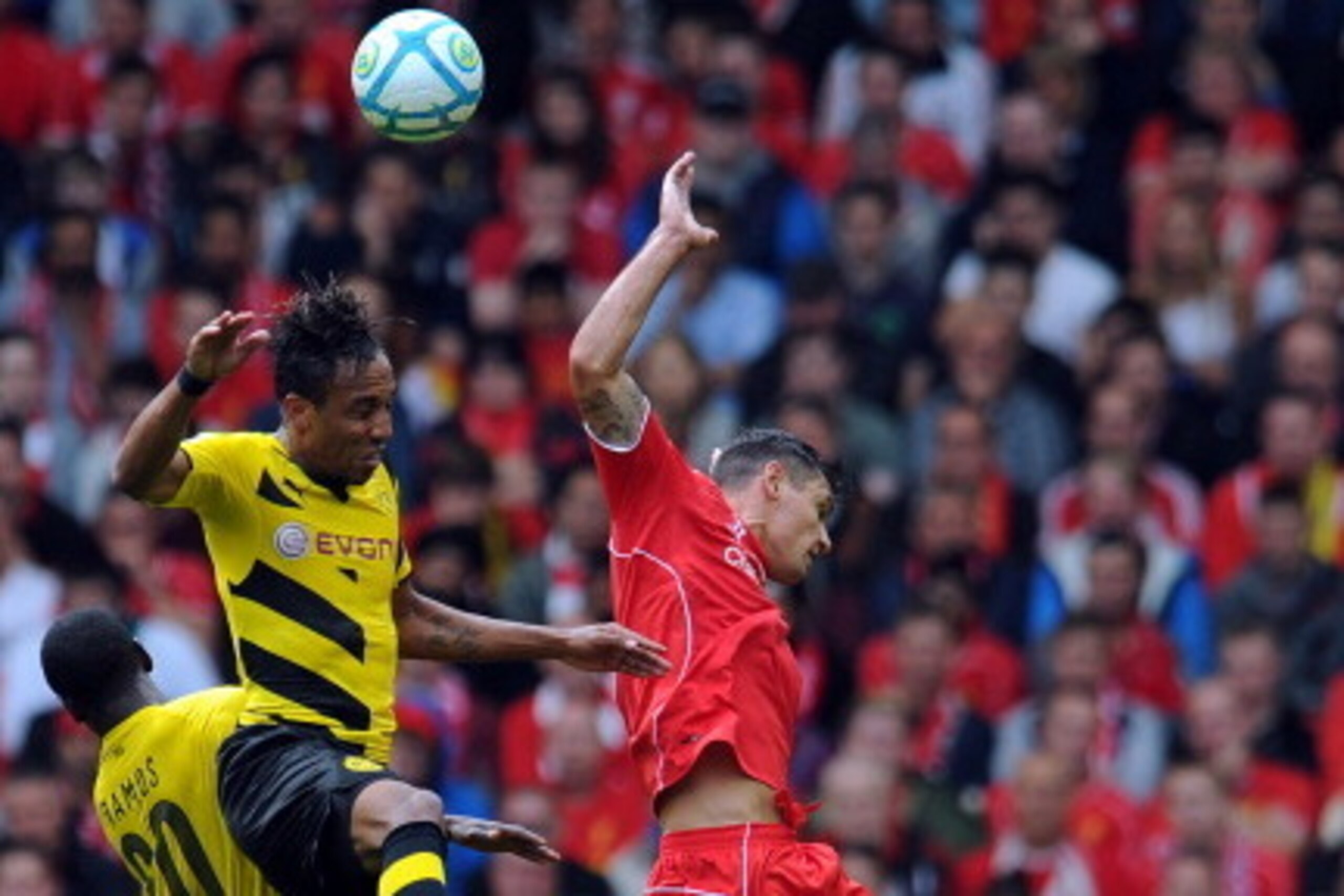 LIVERPOOL, ENGLAND - AUGUST 10:  Dejan Lovren (R) of Liverpool and Pierre Emerick Aubameyang (L) of Borussia Dortmund contest a header during the Pre Season Friendly match between Liverpool and Borussia Dortmund at Anfield on August 10, 2014 in Liverpool,
