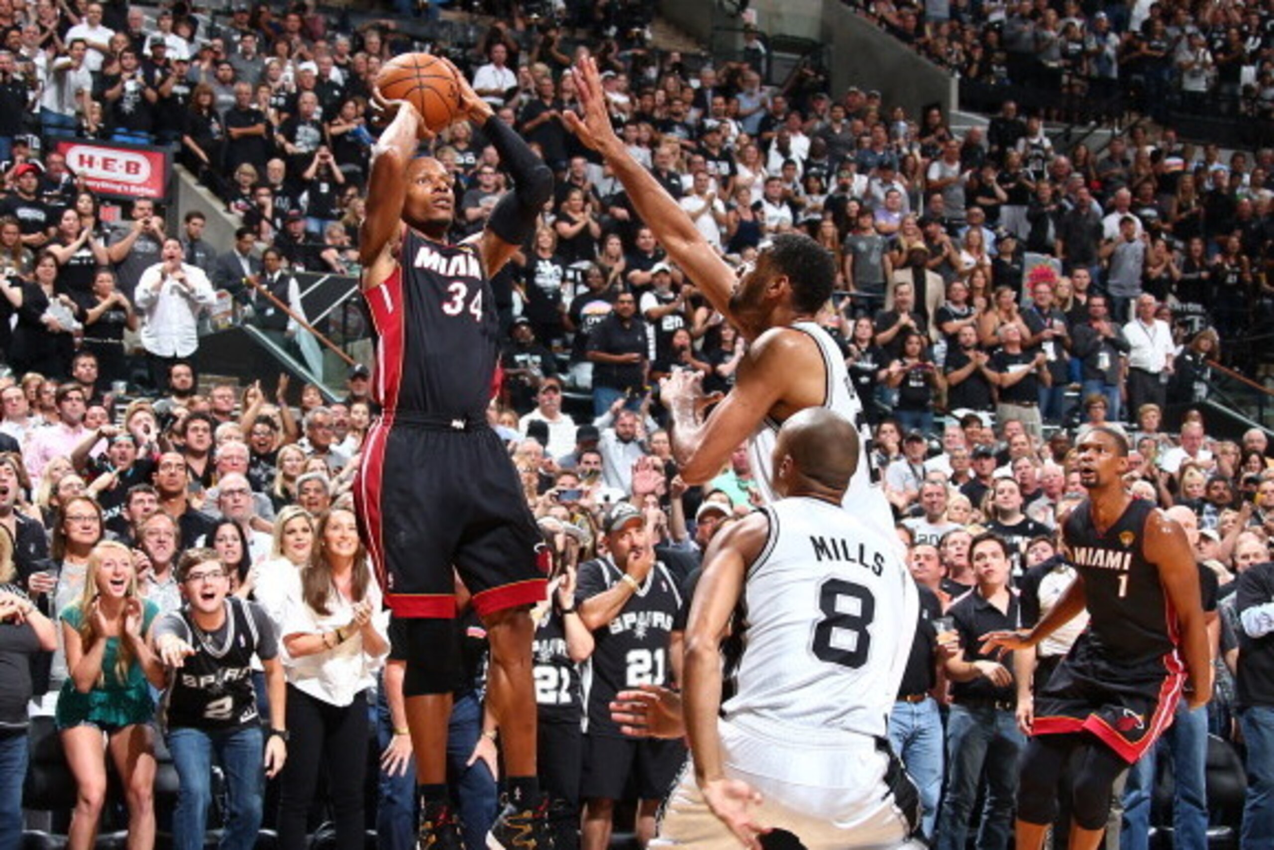 SAN ANTONIO, TX - JUNE 15: Ray Allen #34 of the Miami Heat shoots against Tim Duncan #21 of the San Antonio Spurs during Game Five of the 2014 NBA Finals at AT&T Center on June 15, 2014 in San Antonio, Texas. NOTE TO USER: User expressly acknowledges and 