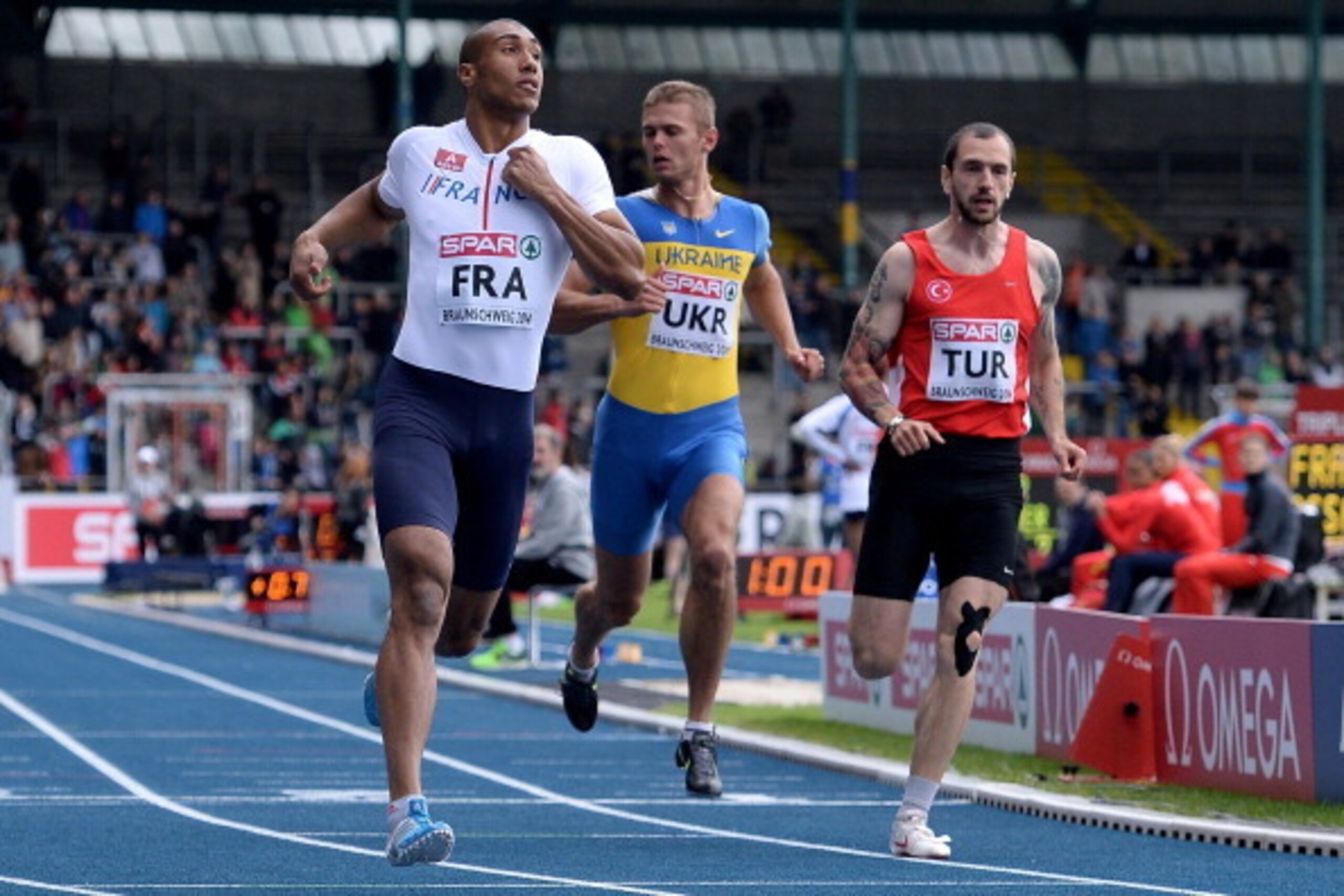 BRAUNSCHWEIG, GERMANY - JUNE 21:  (L-R) Jimmy Vicaut of France, Vitaly Korzh of Ukraine and Ramil Guliyev of Turkey compete in the Men's 100m during first day of the European Athletics Team Championship at Eintracht Stadium on June 21, 2014 in Braunschwei