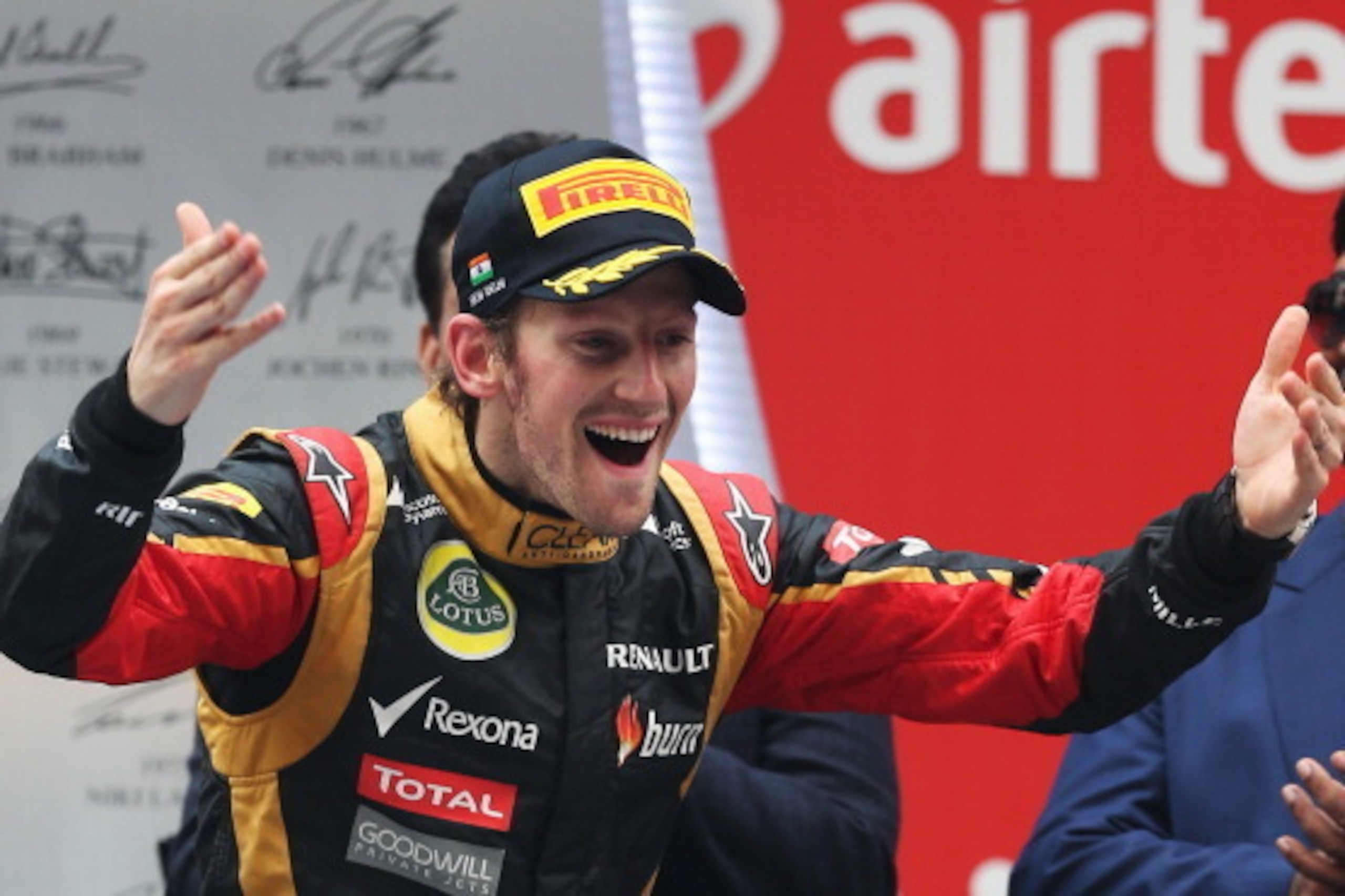 NOIDA, INDIA - OCTOBER 27:  Romain Grosjean of France and Lotus celebrates finishing third during the Indian Formula One Grand Prix at Buddh International Circuit on October 27, 2013 in Noida, India.  (Photo by Mark Thompson/Getty Images)