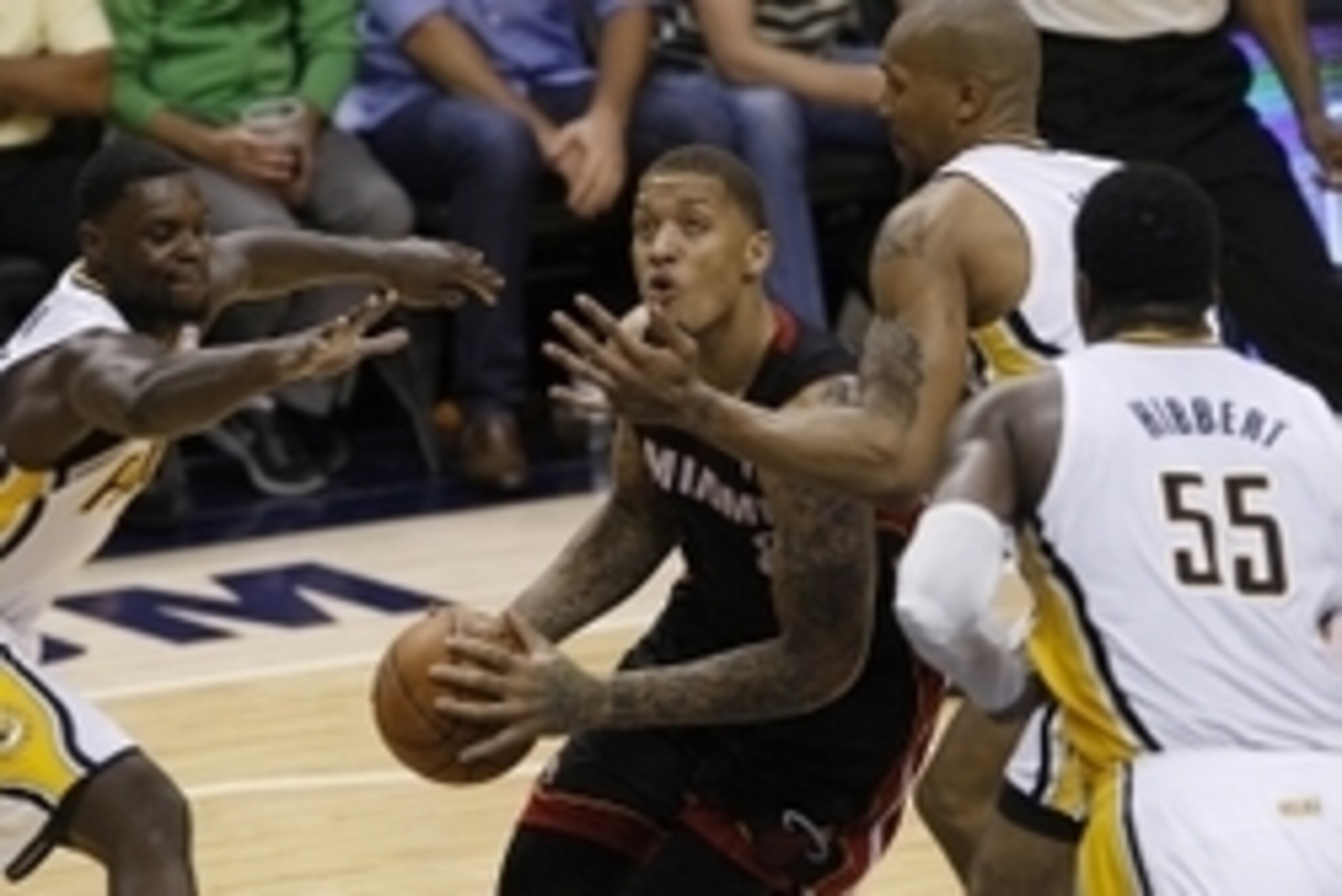 May 28, 2014; Indianapolis, IN, USA; Miami Heat forward Michael Beasley (8) goes up for a shot while being guarded by Indiana Pacers forward David West (21) during the fourth quarter in game five of the Eastern Conference Finals of the 2014 NBA Playoffs a