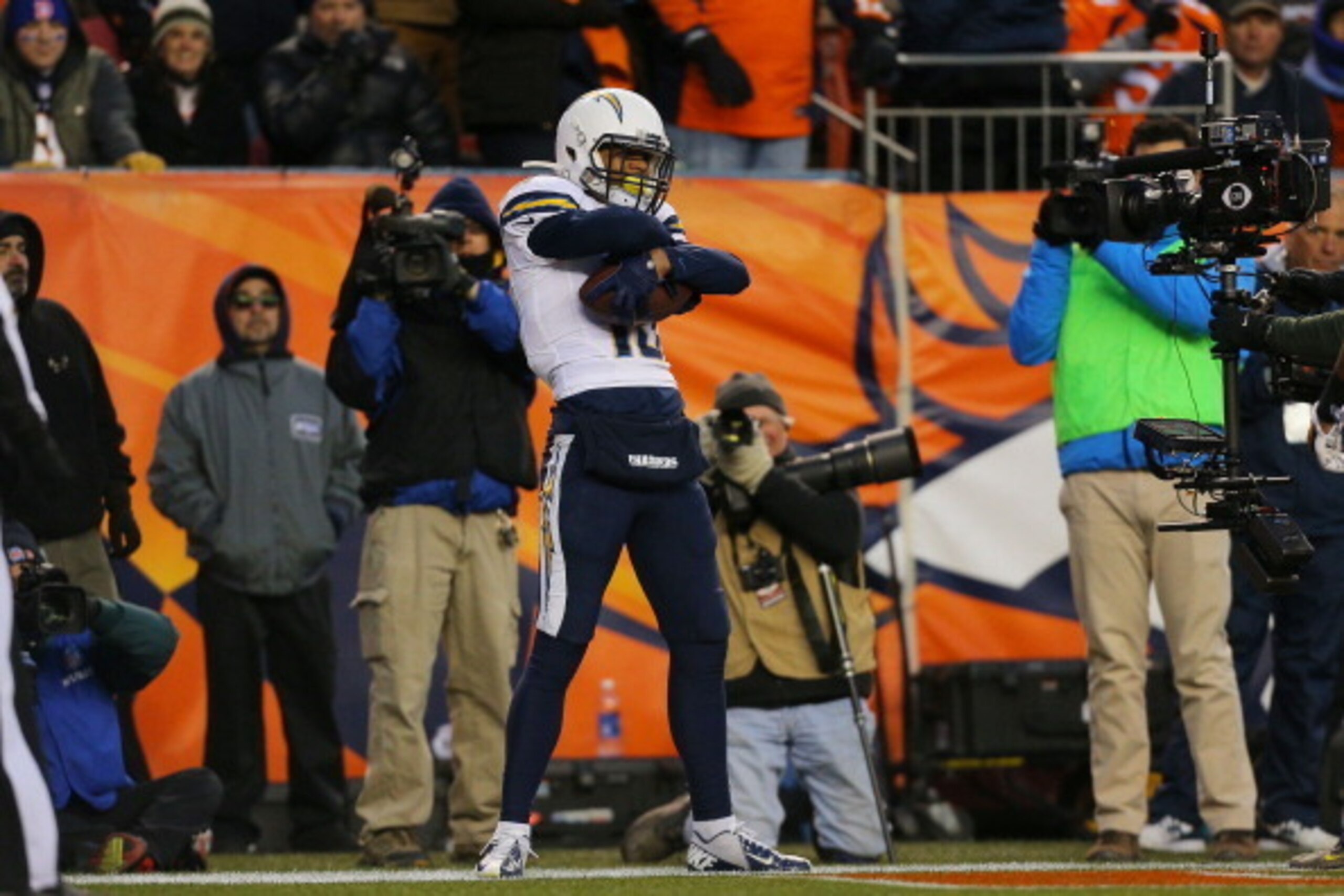 DENVER, CO - JANUARY 12:  Keenan Allen #13 of the San Diego Chargers celebrates his fourth quarter touchdown against the Denver Broncos during the AFC Divisional Playoff Game at Sports Authority Field at Mile High on January 12, 2014 in Denver, Colorado. 