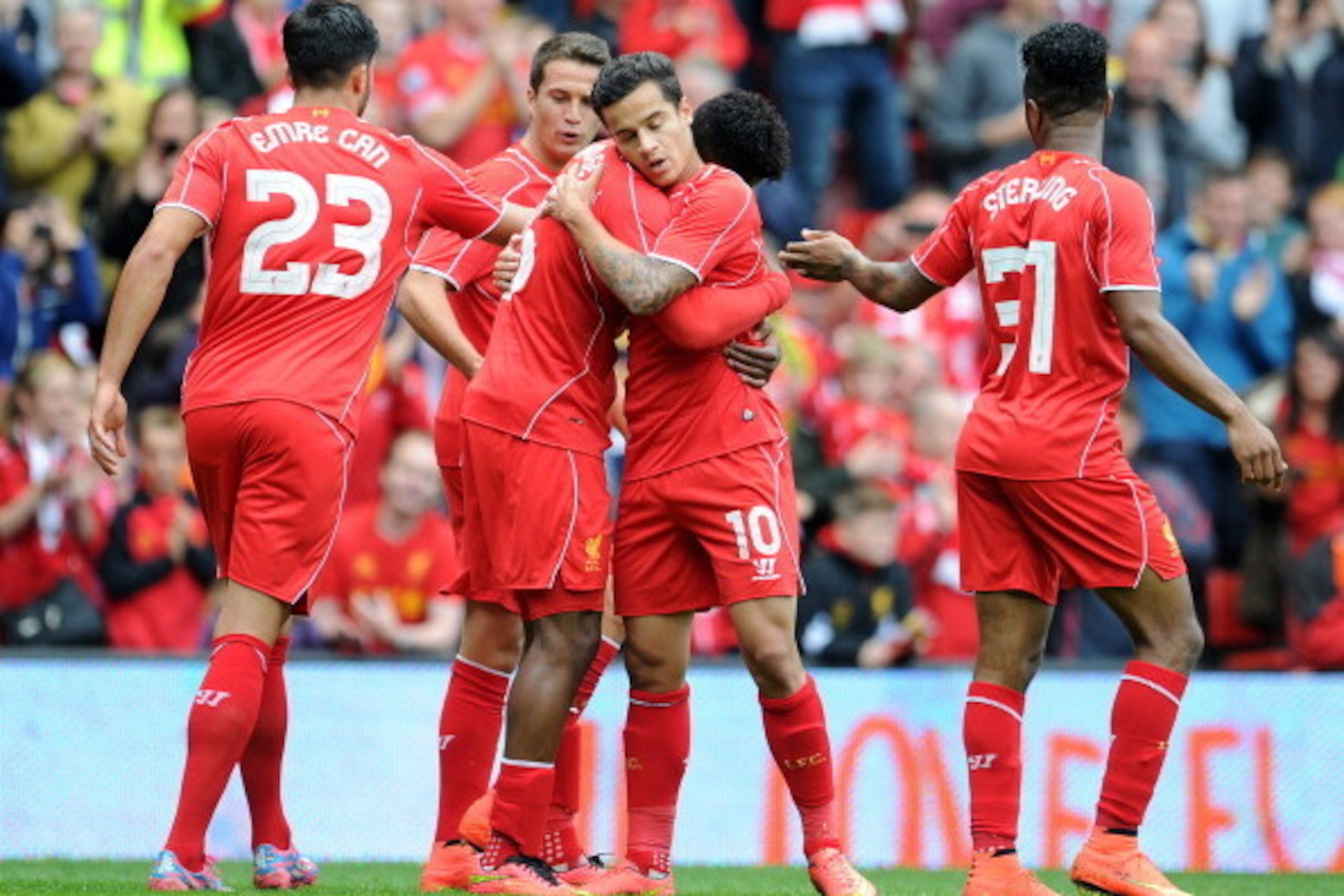 LIVERPOOL, ENGLAND - AUGUST 10:  Daniel Sturridge (C) of Liverpool celebrates with team-mate Philippe Coutinho after he scores the first goal of the game for his side during the Pre Season Friendly match between Liverpool and Borussia Dortmund at Anfield 