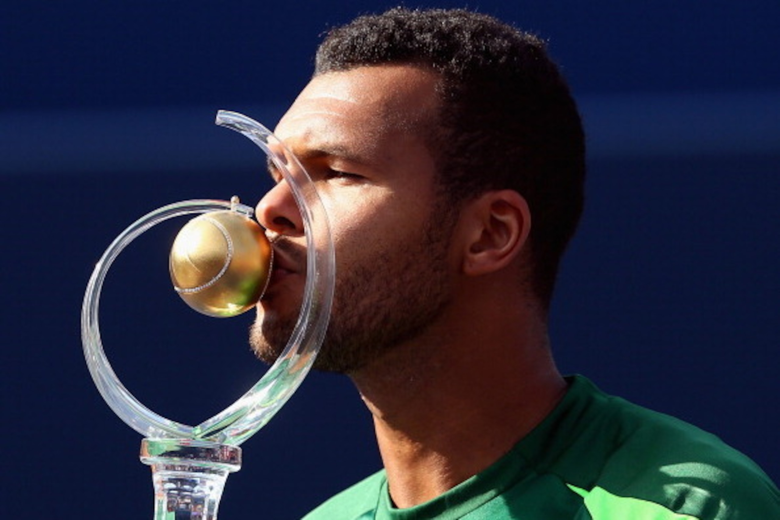 TORONTO, ON - AUGUST 10:  Jo-Wilfried Tsonga of France kisses the Rogers Cup trophy after his win against Roger Federer of Switzerland during Rogers Cup at Rexall Centre at York University on August 10, 2014 in Toronto, Canada.  (Photo by Ronald Martinez/