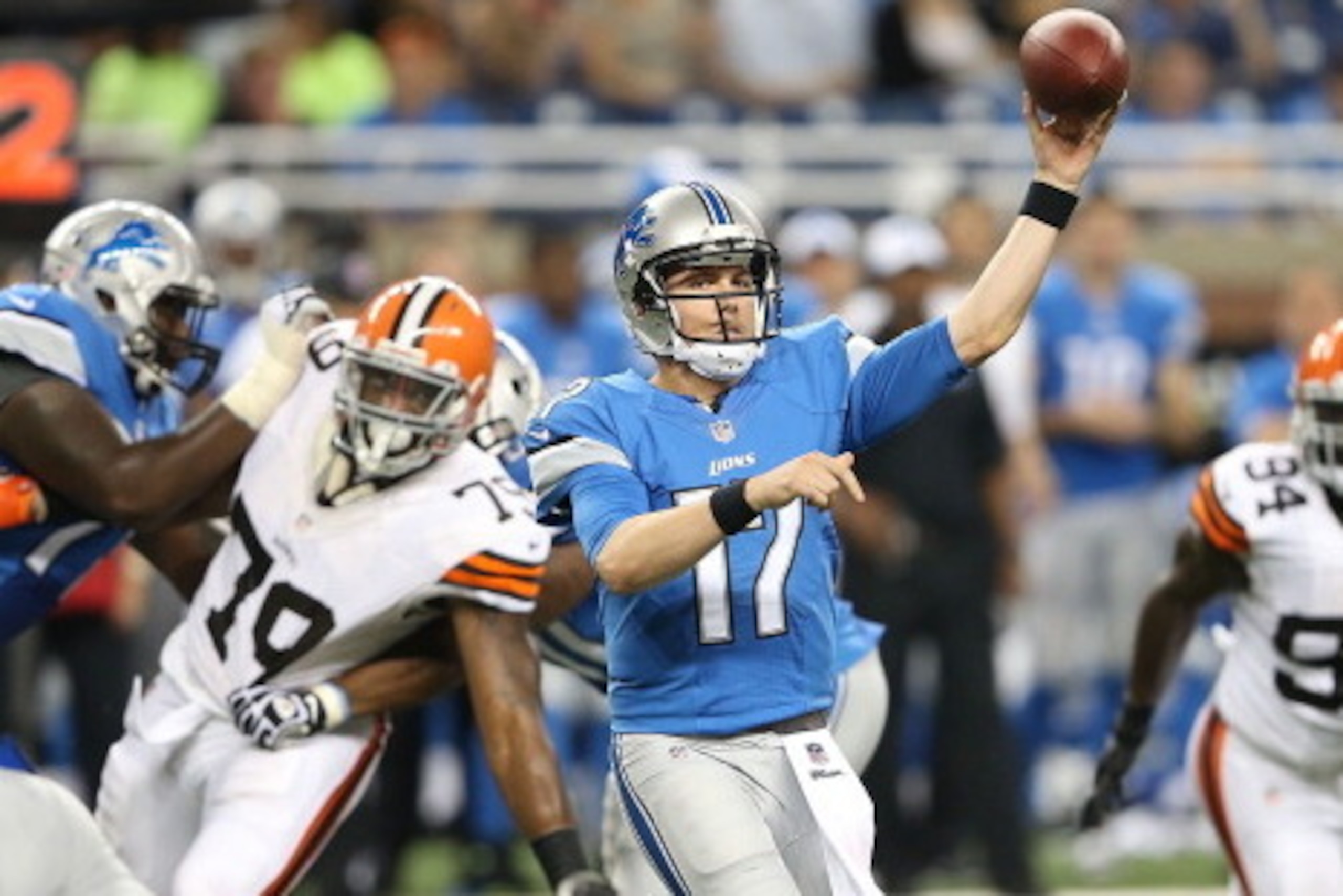DETROIT, MI - AUGUST 09:  Corey Fuller #10 of the Detroit Lions drops back to pass during the fourth quarter of the preseason game against the Cleveland Browns at Ford Field on August 9, 2014 in Detroit, Michigan. The Lions defeated the Browns 13-12.  (Ph