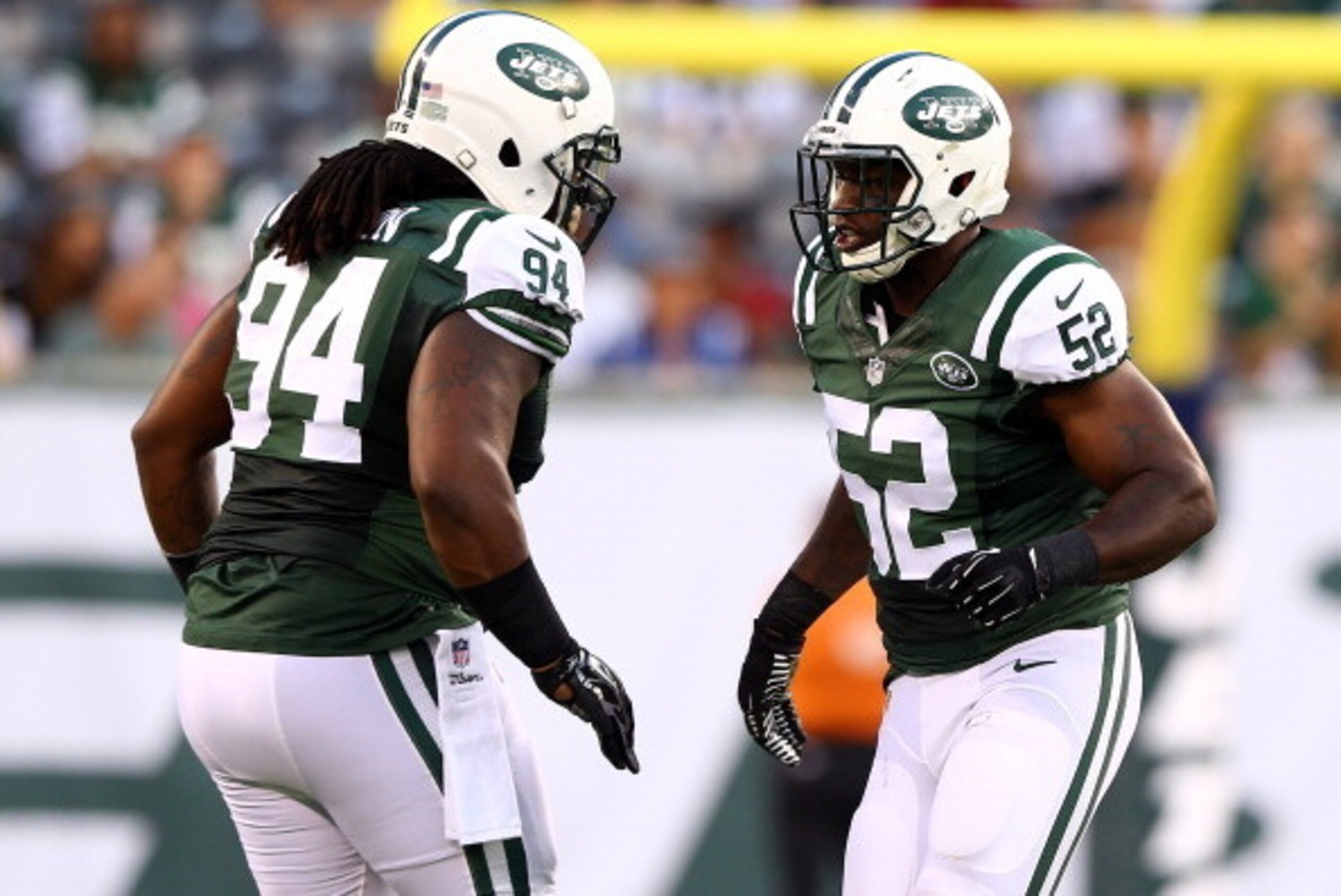EAST RUTHERFORD, NJ - AUGUST 07: Inside linebacker David Harris #52 celebrates a sack with nose tackle Damon Harrison #94 of the New York Jets against the Indianapolis Colts during a preseason game at MetLife Stadium on August 7, 2014 in East Rutherford, 