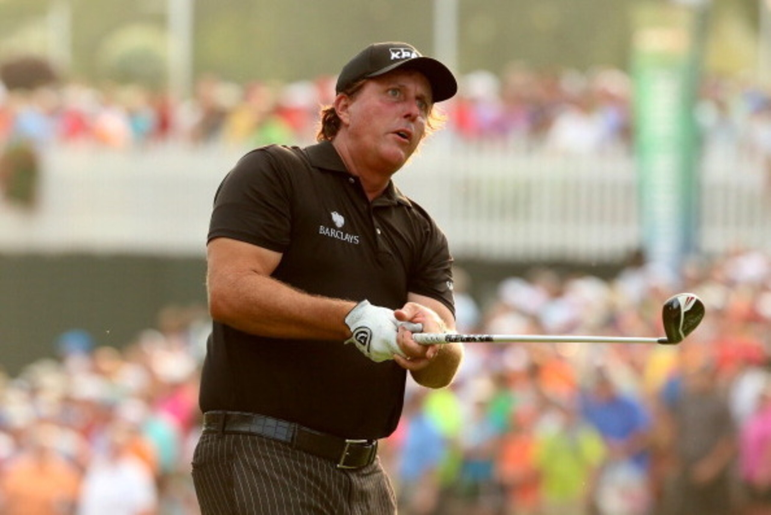 LOUISVILLE, KY - AUGUST 10: Phil Mickelson of the United States hits his tee shot on the 14th hole during the final round of the 96th PGA Championship at Valhalla Golf Club on August 10, 2014 in Louisville, Kentucky.  (Photo by Andrew Redington/Getty Imag