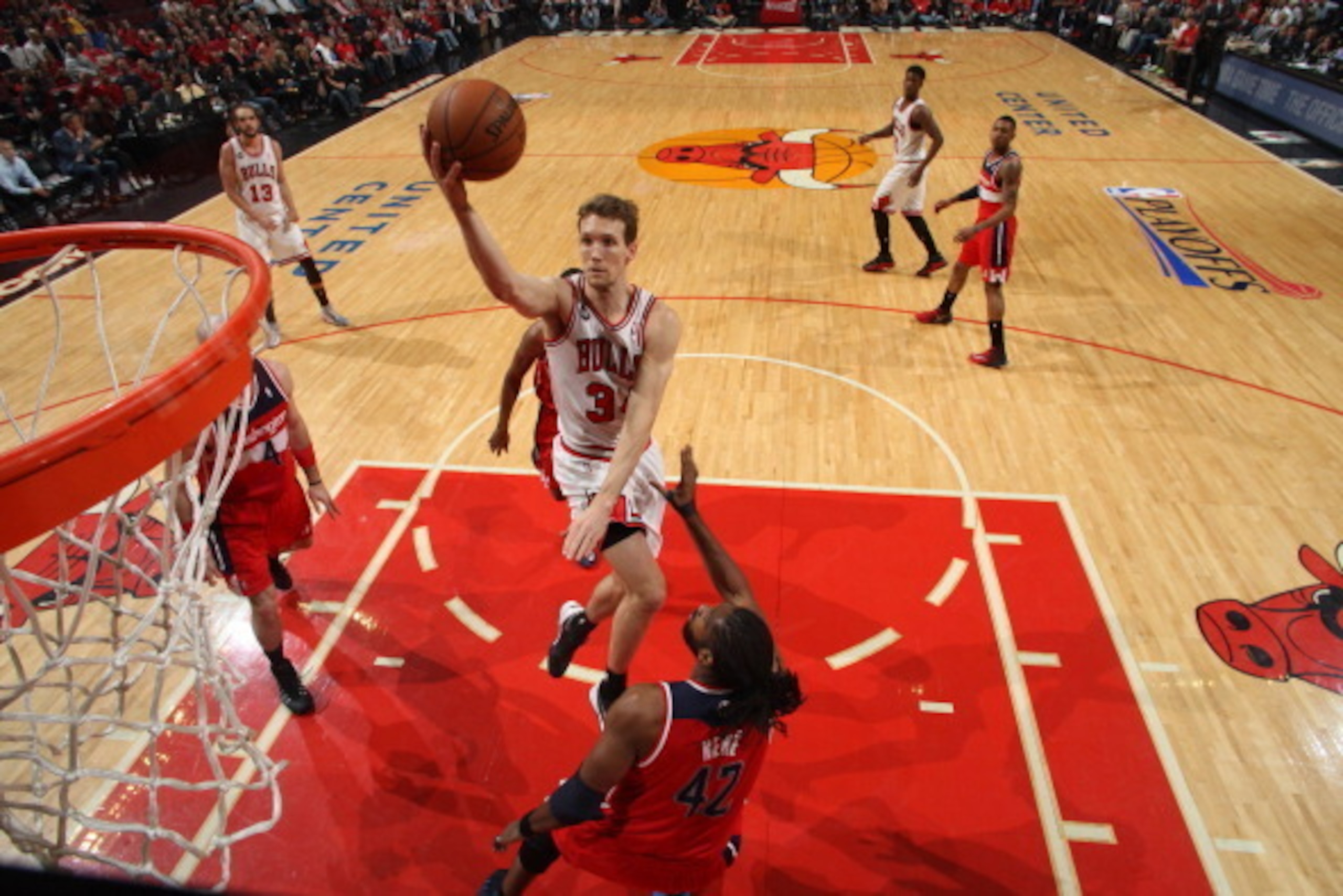 CHICAGO, IL - APRIL 29: Mike Dunleavy #34 of the Chicago Bulls shoots against Nene #42 of the Washington Wizards in Game 5 of the Eastern Conference Quarterfinals in the 2014 NBA Playoffs on April 29, 2014 at the United Center in Chicago, Illinois. NOTE T