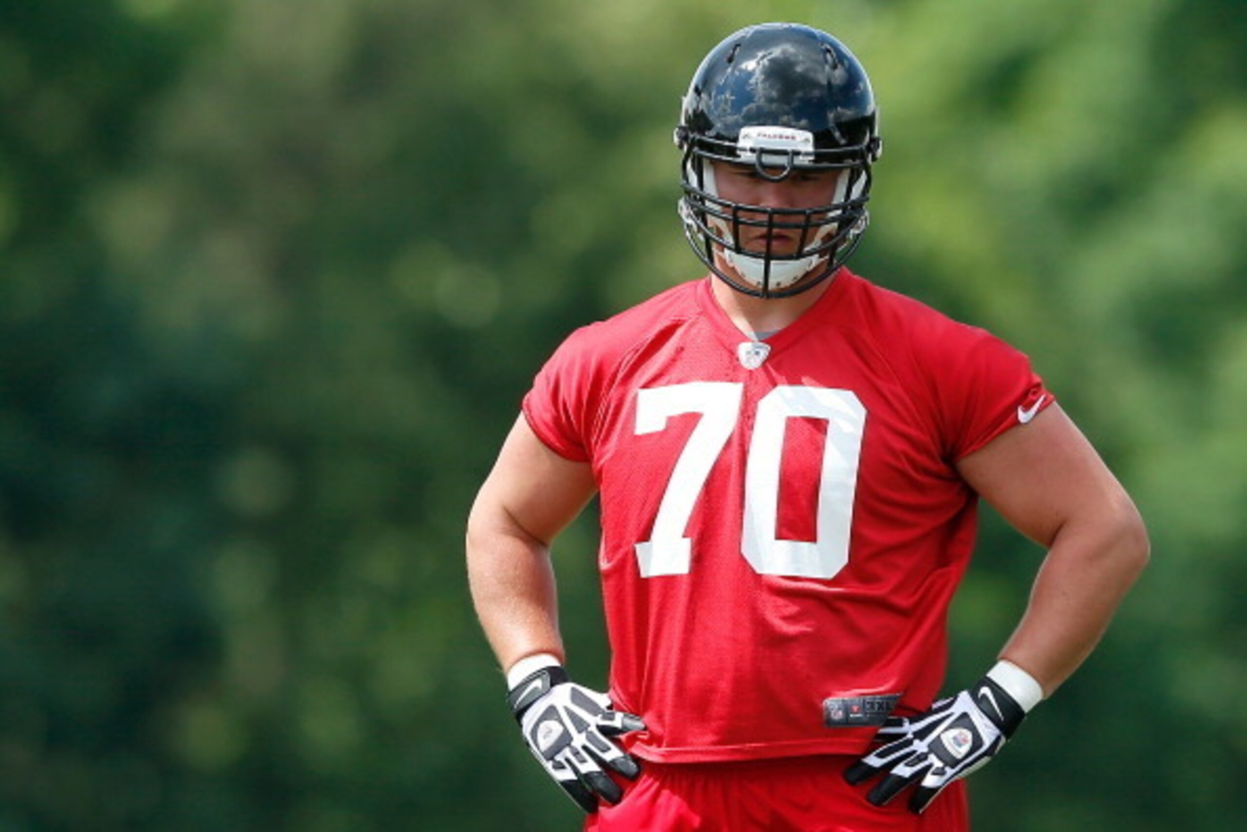 FLOWERY BRANCH, GA - MAY 16:  Rookie offensive tackle Jake Matthews #70 of the Atlanta Falcons runs drills during rookie minicamp at the Atlanta Falcons Training Facility on May 16, 2014 in Flowery Branch, Georgia.  (Photo by Kevin C. Cox/Getty Images)
