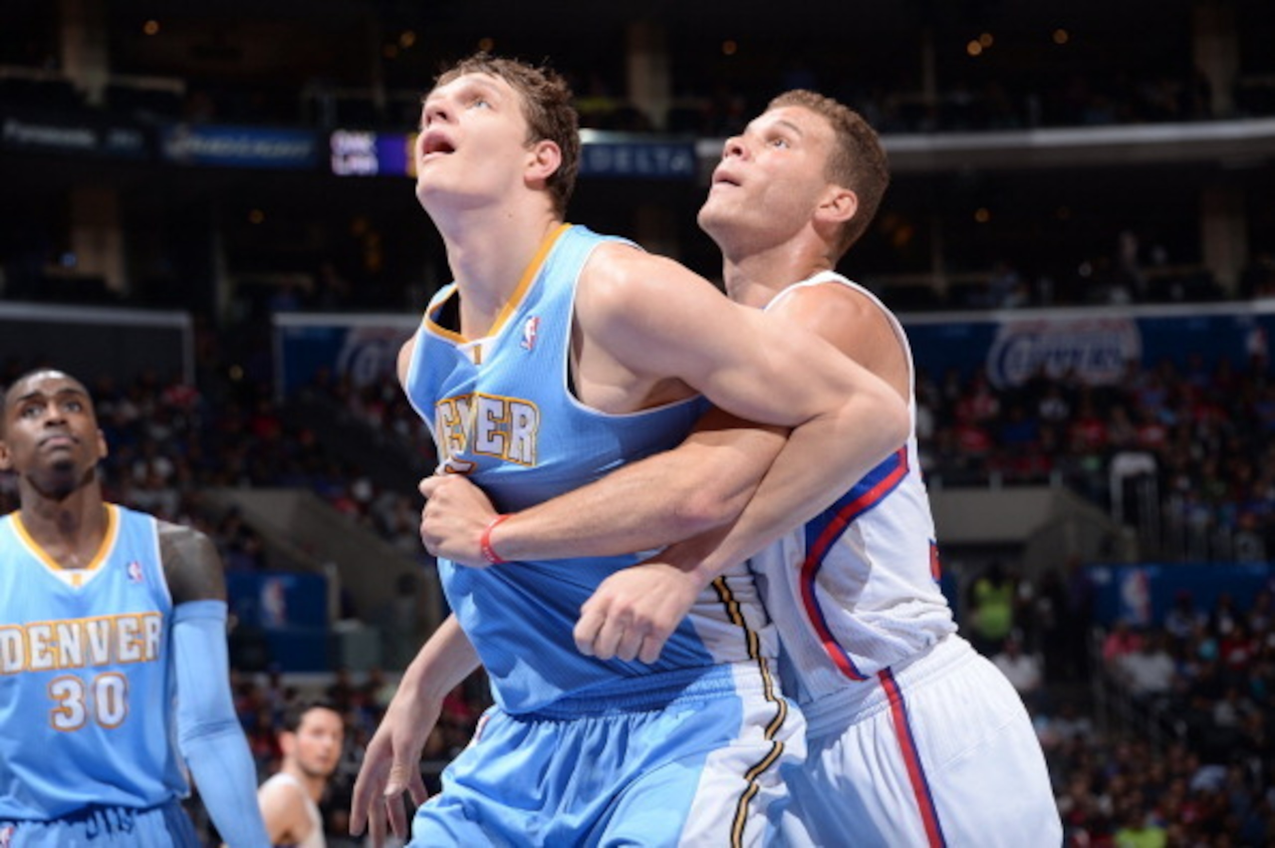LOS ANGELES, CA - APRIL 15: Timofey Mozgov #25 of the Denver Nuggets battles for position against Blake Griffin #32 of the Los Angeles Clippers at Staples Center on April 15, 2014 in Los Angeles, California. NOTE TO USER: User expressly acknowledges and a