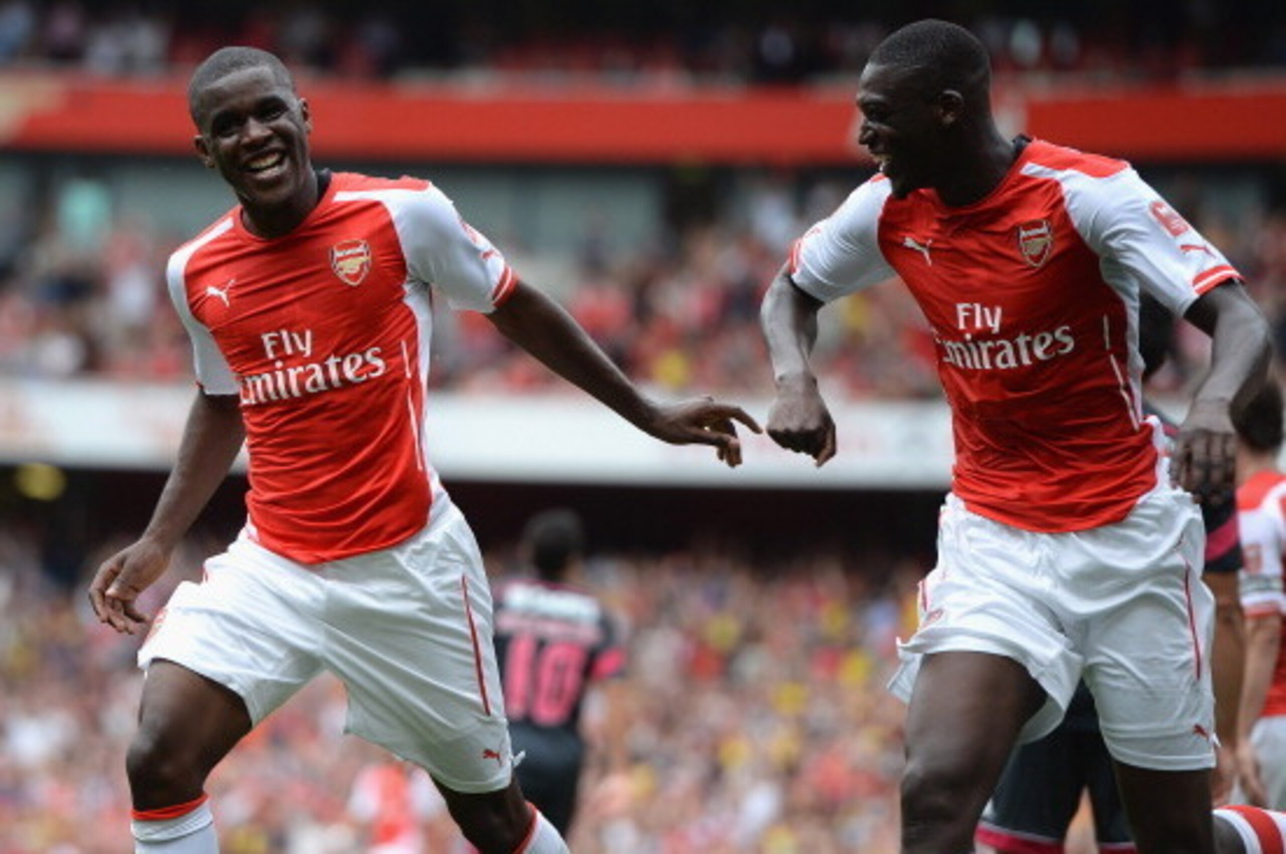 LONDON, ENGLAND - AUGUST 02:  Joel Campbell of Arsenal celebrates scoring with Yaya Sanogo during the Emirates Cup match between Arsenal and Benfica at the Emirates Stadium on August 2, 2014 in London, England.  (Photo by Michael Regan/Getty Images)