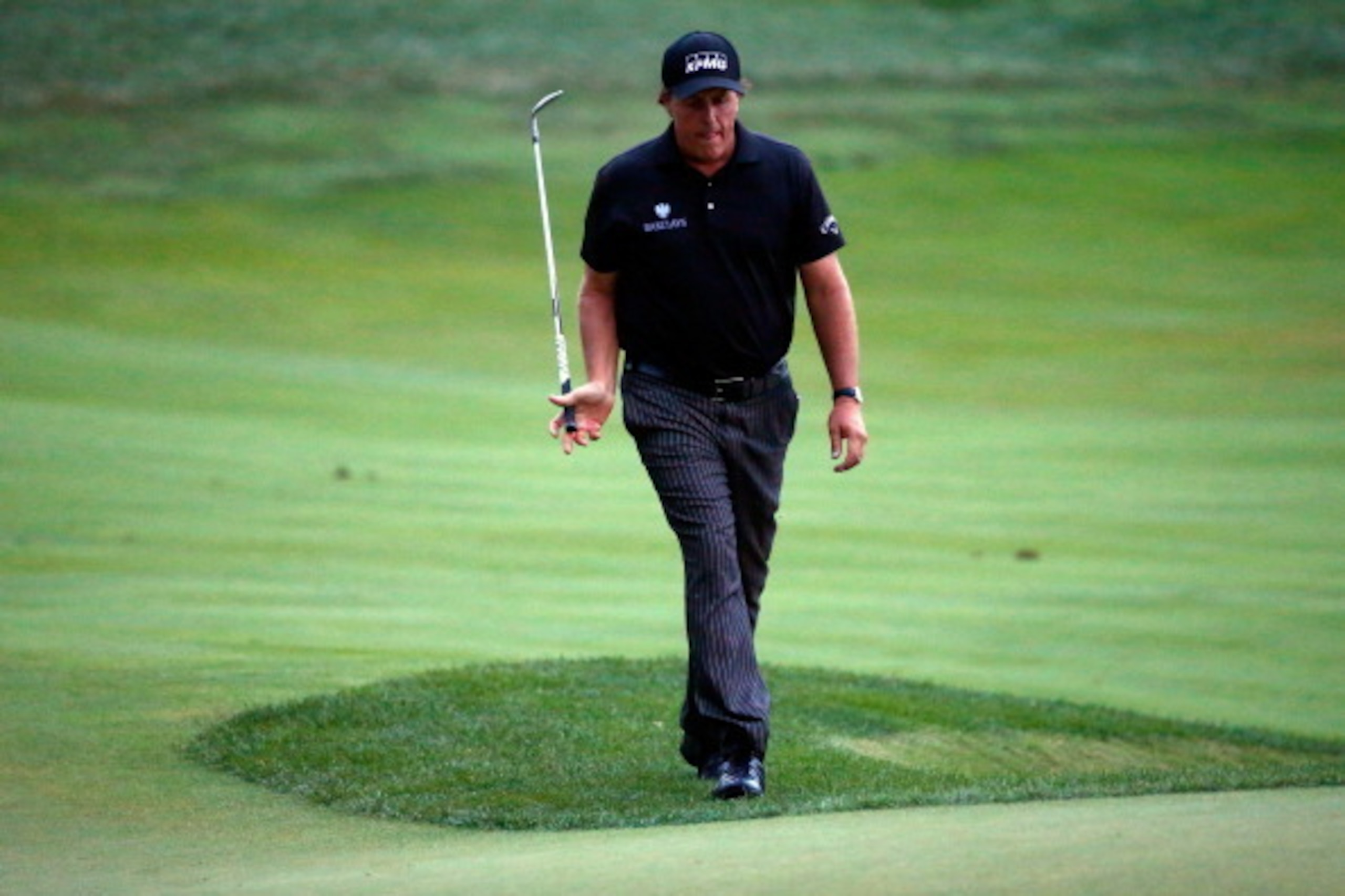 LOUISVILLE, KY - AUGUST 10:  Phil Mickelson of the United States walks to the 18th green during the final round of the 96th PGA Championship at Valhalla Golf Club on August 10, 2014 in Louisville, Kentucky.  (Photo by Sam Greenwood/Getty Images)