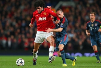 MANCHESTER, ENGLAND - APRIL 01:  Marouane Fellaini of Manchester United and Franck Ribery of Bayern Muenchen battle for the ball during the UEFA Champions League Quarter Final first leg match between Manchester United and FC Bayern Muenchen at Old Traffor